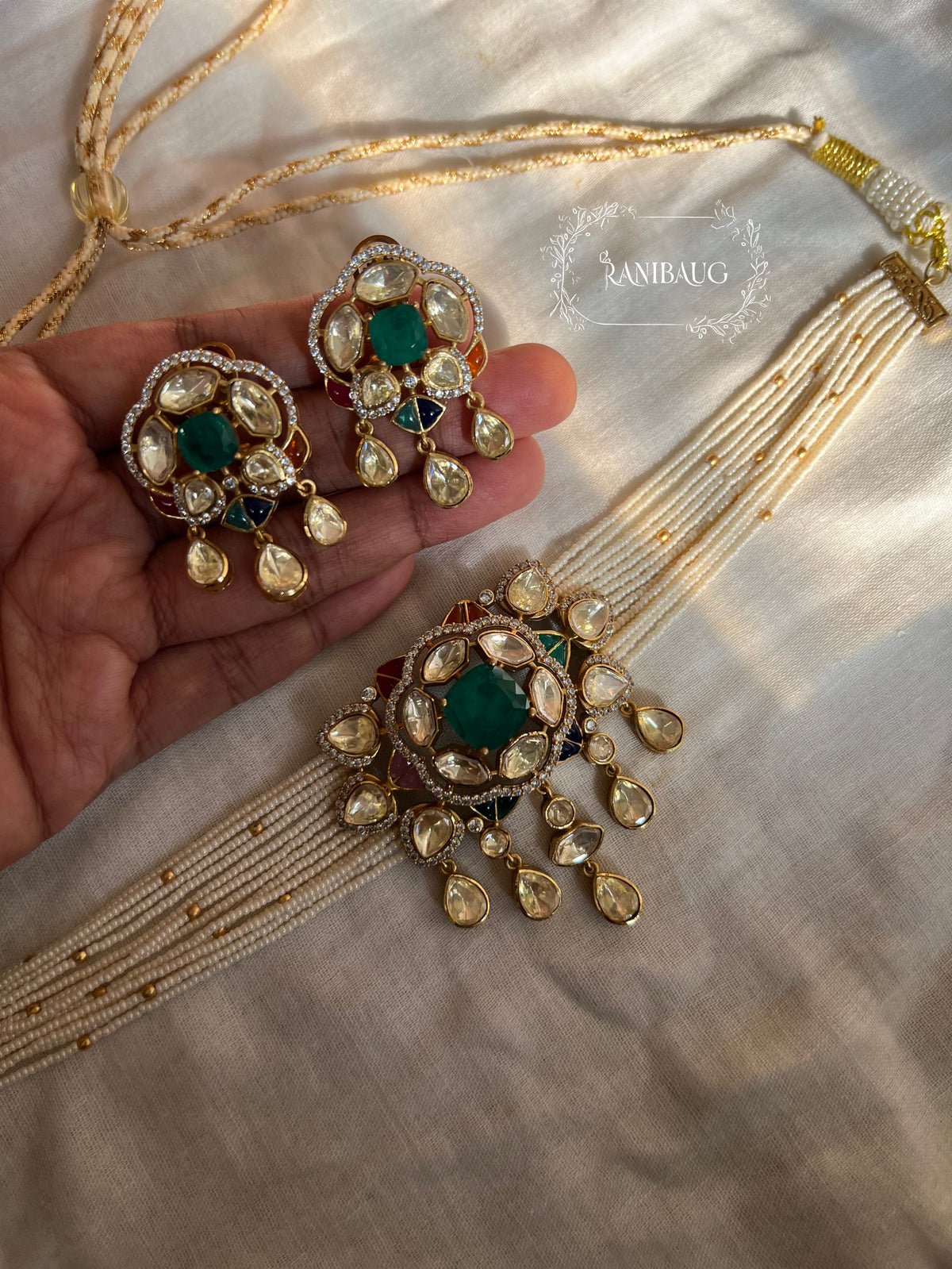 Avantika Emerald Mossainite Gold Finish Ssed Pearl Strand Statement Choker Set By Ranibaug