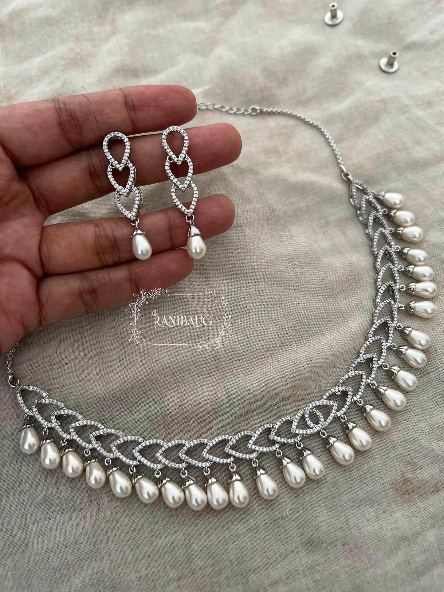 Avni Pearl Adorned Diamond Structured Necklace Set By Ranibaug