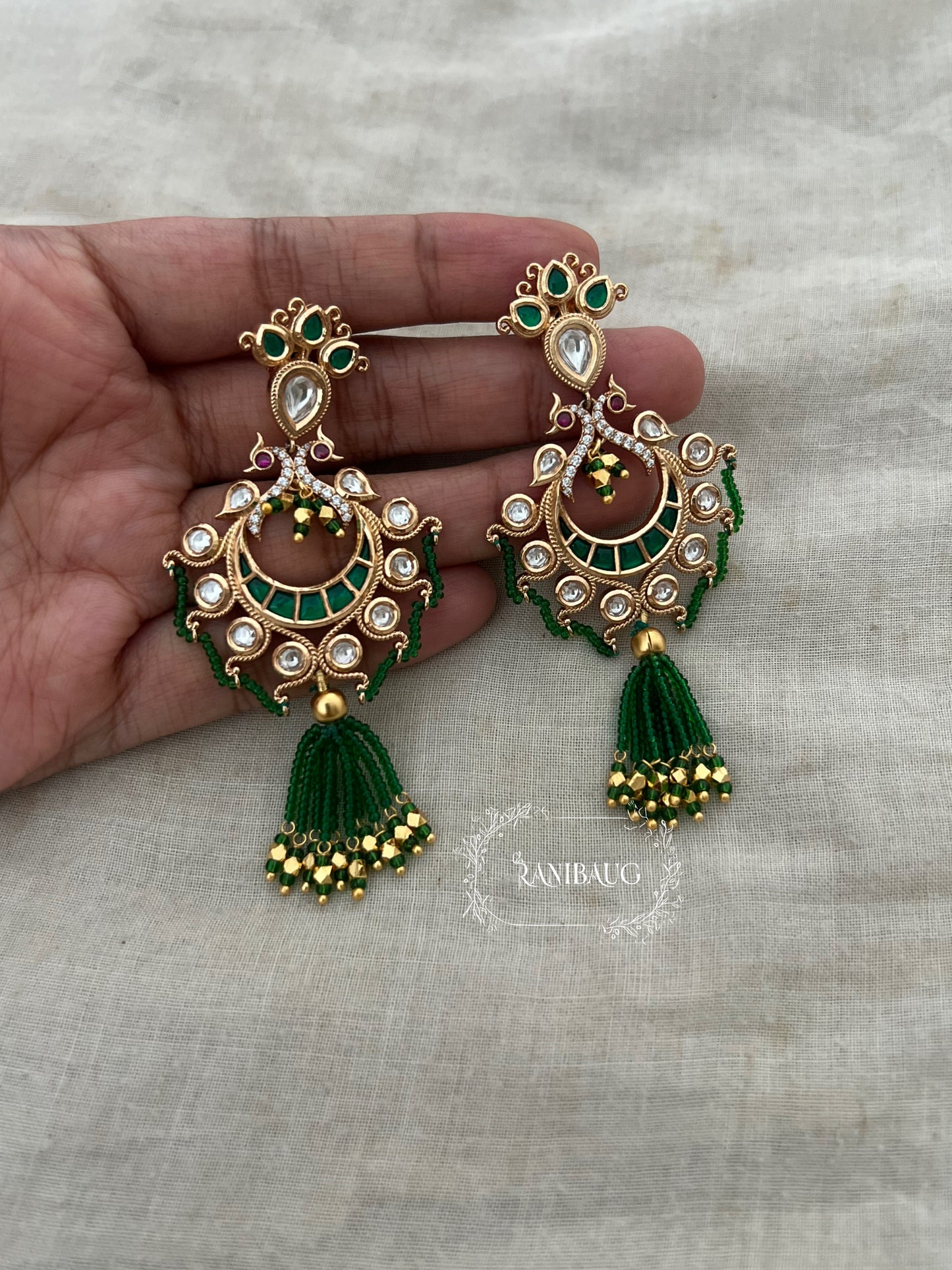 Devyani Peacock Motif Emerald Tassel Chandbali Earrings By Ranibaug
