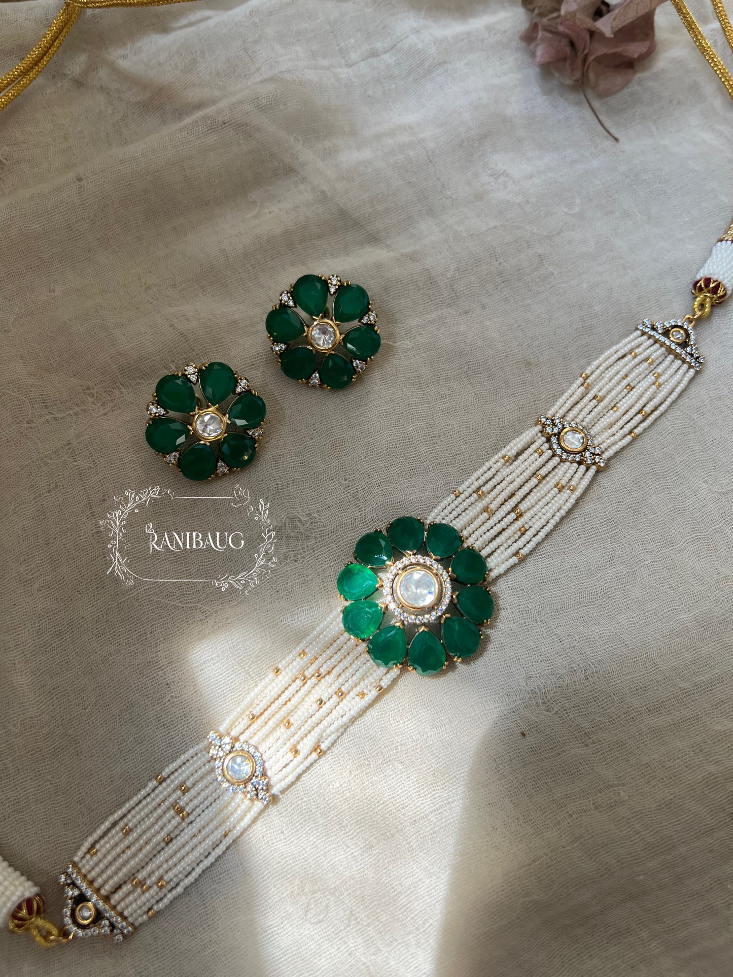 Mandeep Emerald Green Floral Motif In Pearl Tassel Choker Jewellery Set With Flower Ear Studs By Ranibaug