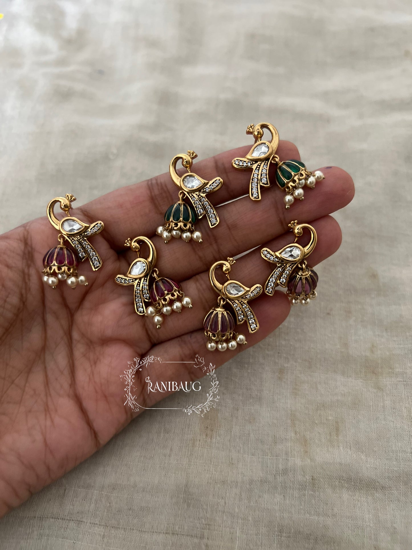 Mayra Peacock Motif Polki Pearl Studded Enamel Zirconia Adorned Premium Gold Plated Ear Studs Jewelry By Ranibaug