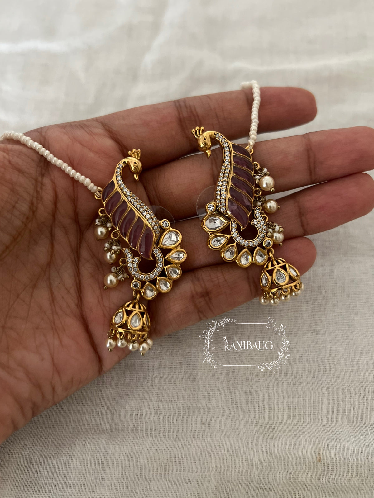 Natasha Statement Peacock Motif Gold Plated Polki Studded Earcuff Jhumki With Mini Pearl Hair Chain By Ranibaug | Designer Latest Festive Earrings Collection 2026