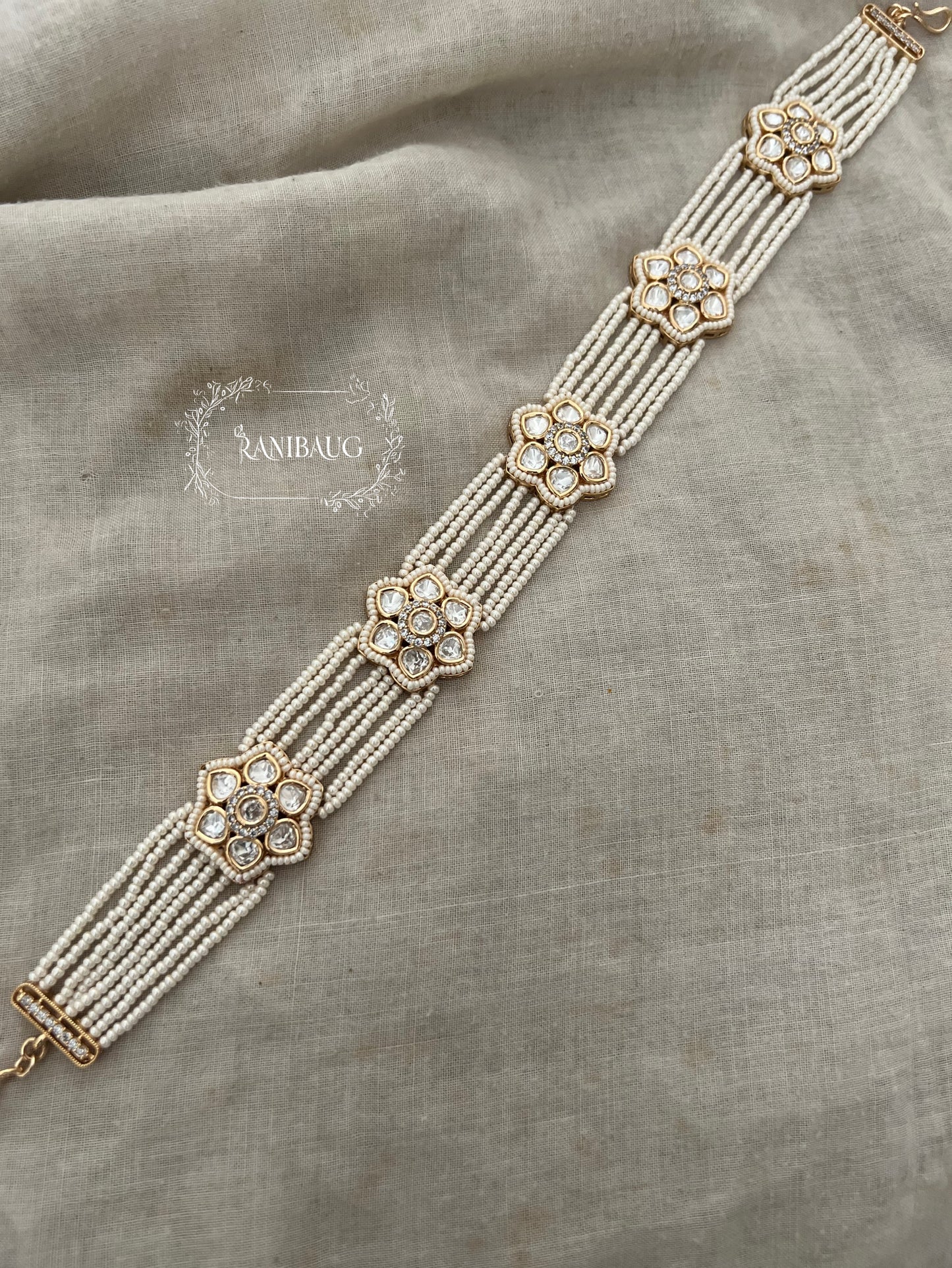 Nishika Polki Floral Sheeshpatti With Multi-Strand Pearl Detailing In Rich Gold Finish By Ranibaug