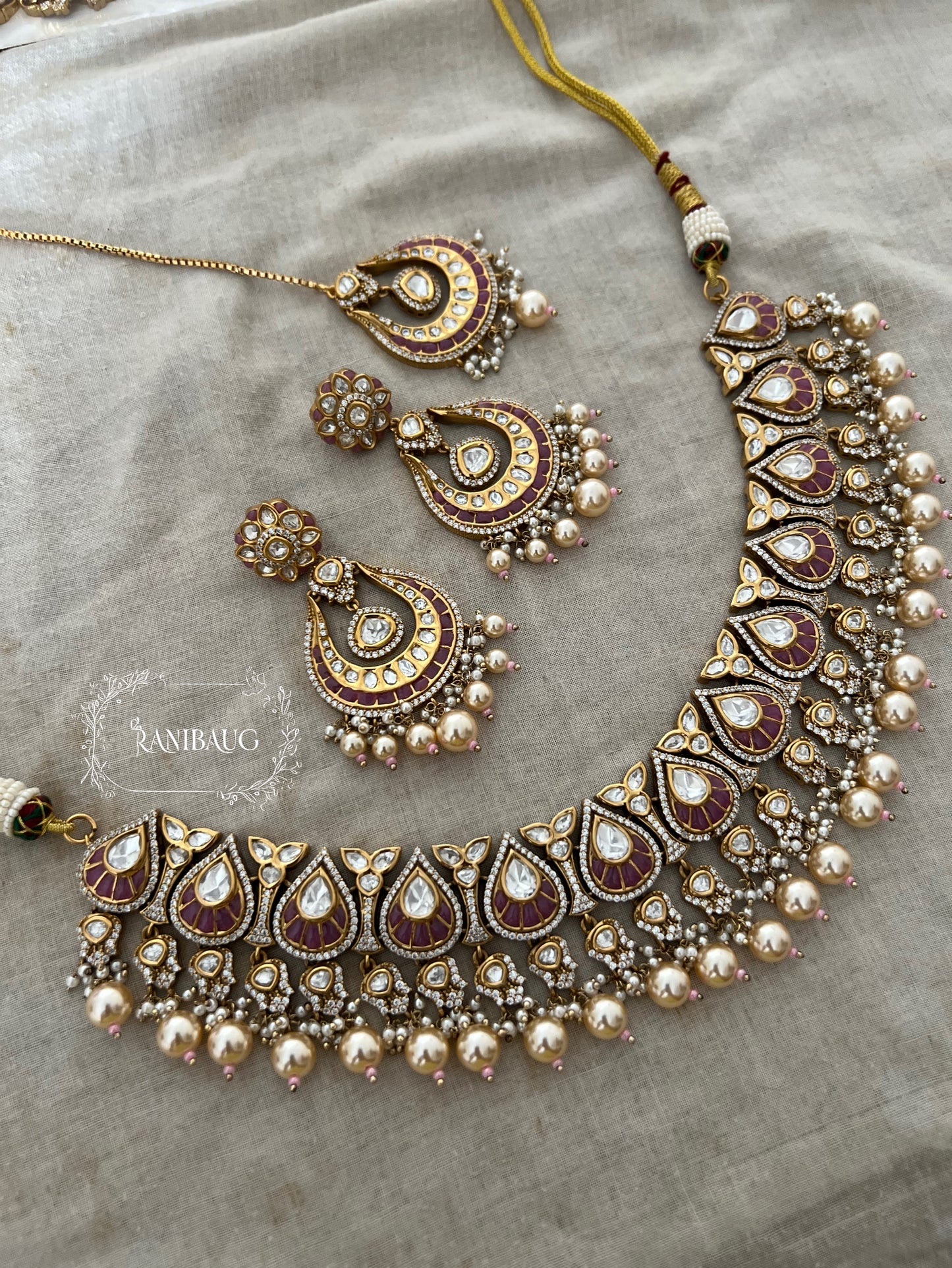 Nita Polki Kundan Necklace Set In Teardrop Enamel Motifs And Shiny Pearl Fringes In Premium Gold Finish With Contrasting Maangtikka By Ranibaug