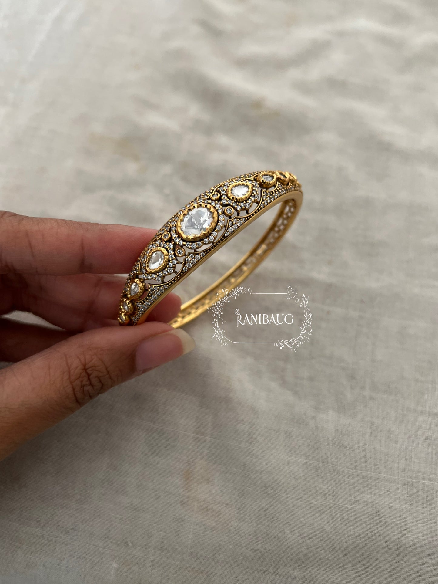 Rajgiri Gold Finish Polki Studded Zirconia Stones Adorned Royal Bracelet By Ranibaug
