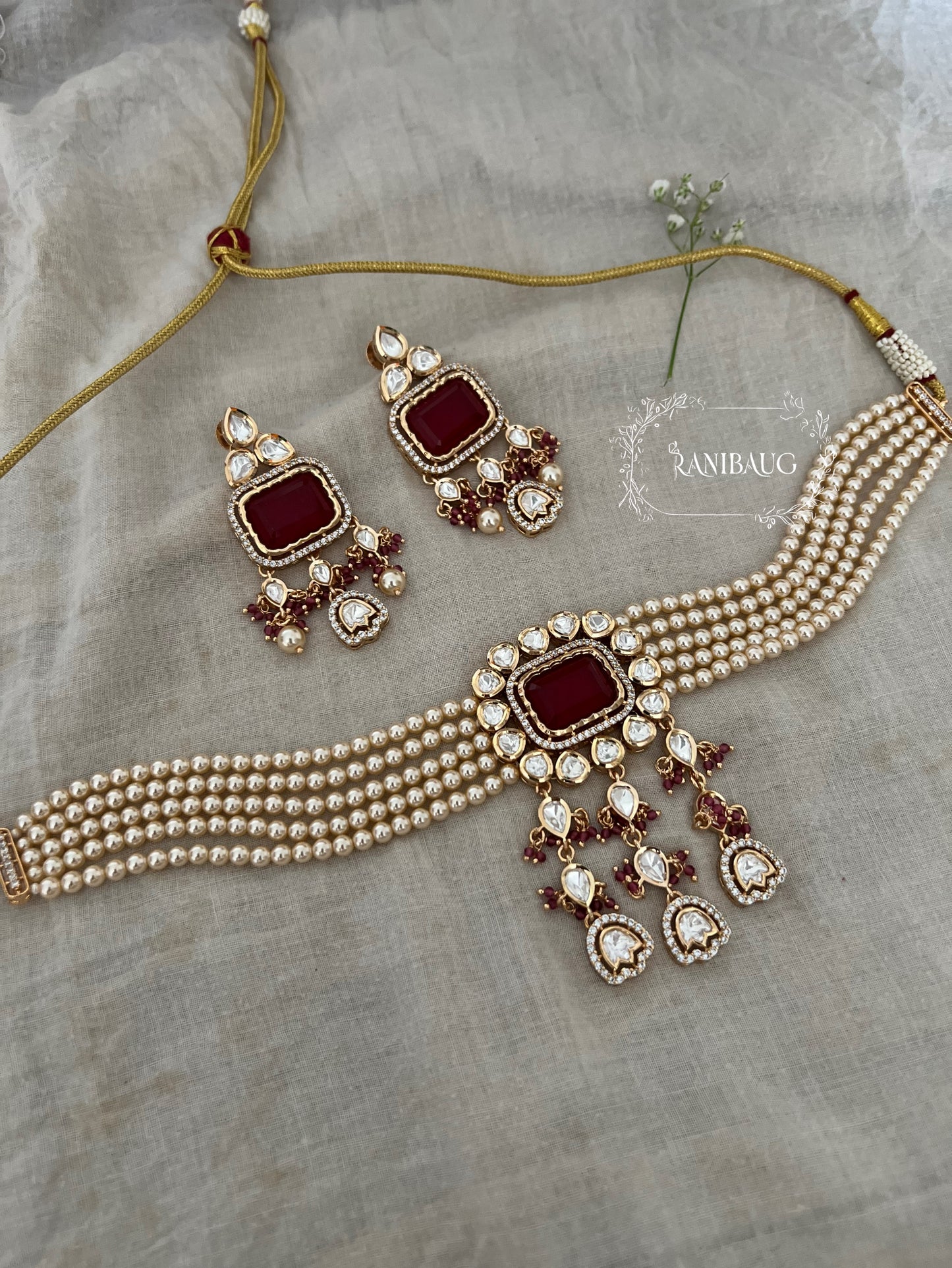 Siddhi Gold Plated Polki And Pearl Choker Set With Rectangle Gemstone Motif And Contrasting Bead Accents By Ranibaug