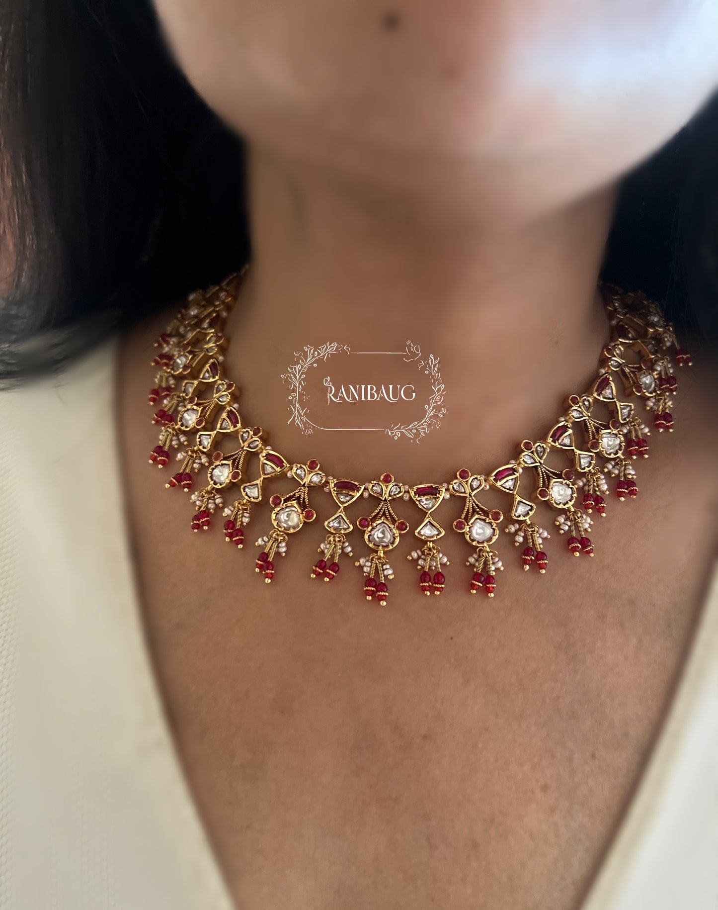 The Rukmini Rang-Mahal Polki Hourglass Necklace | Ruby & Emerald Geometric Fringe Set by Ranibaug