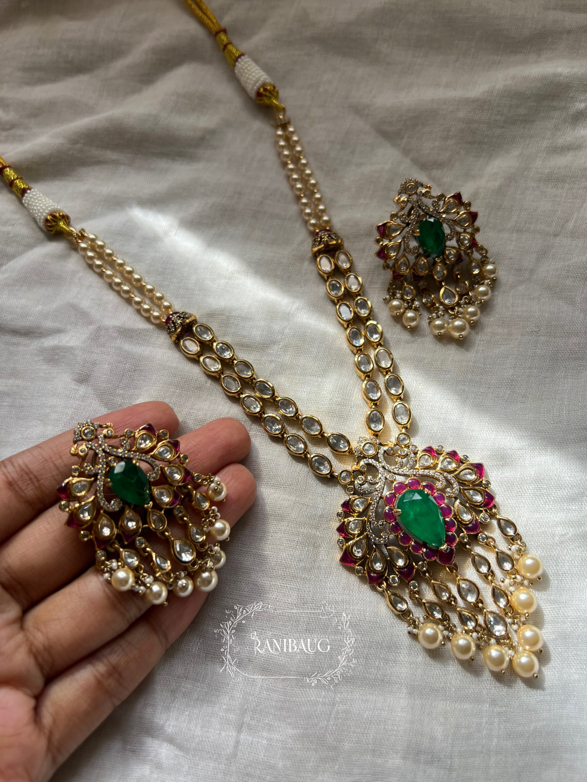 Zarika Geometric Polki Studded Gold Finish Emerald Stones Adorned Two Layered Necklace Set By Ranibaug