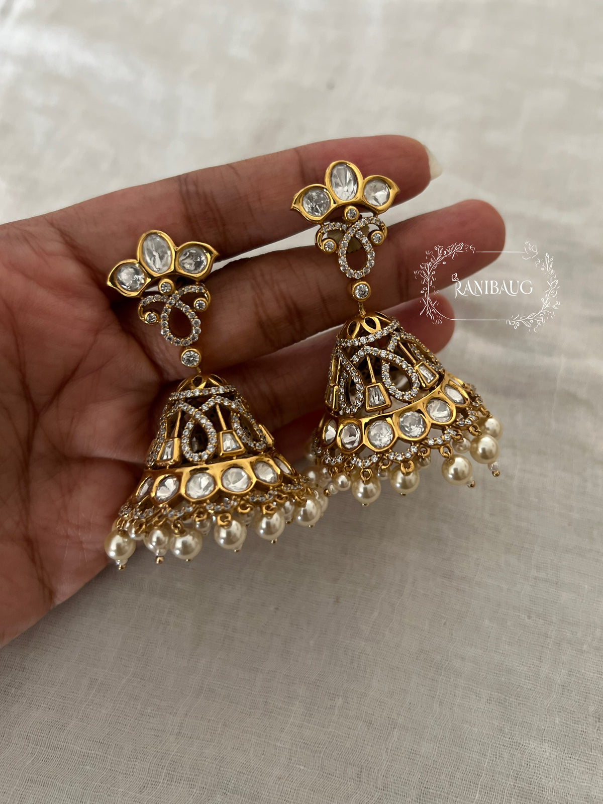 Aari Zirconnia Gold Finish Kundan Pearl Adorned Jhumka Earrings By Ranibaug