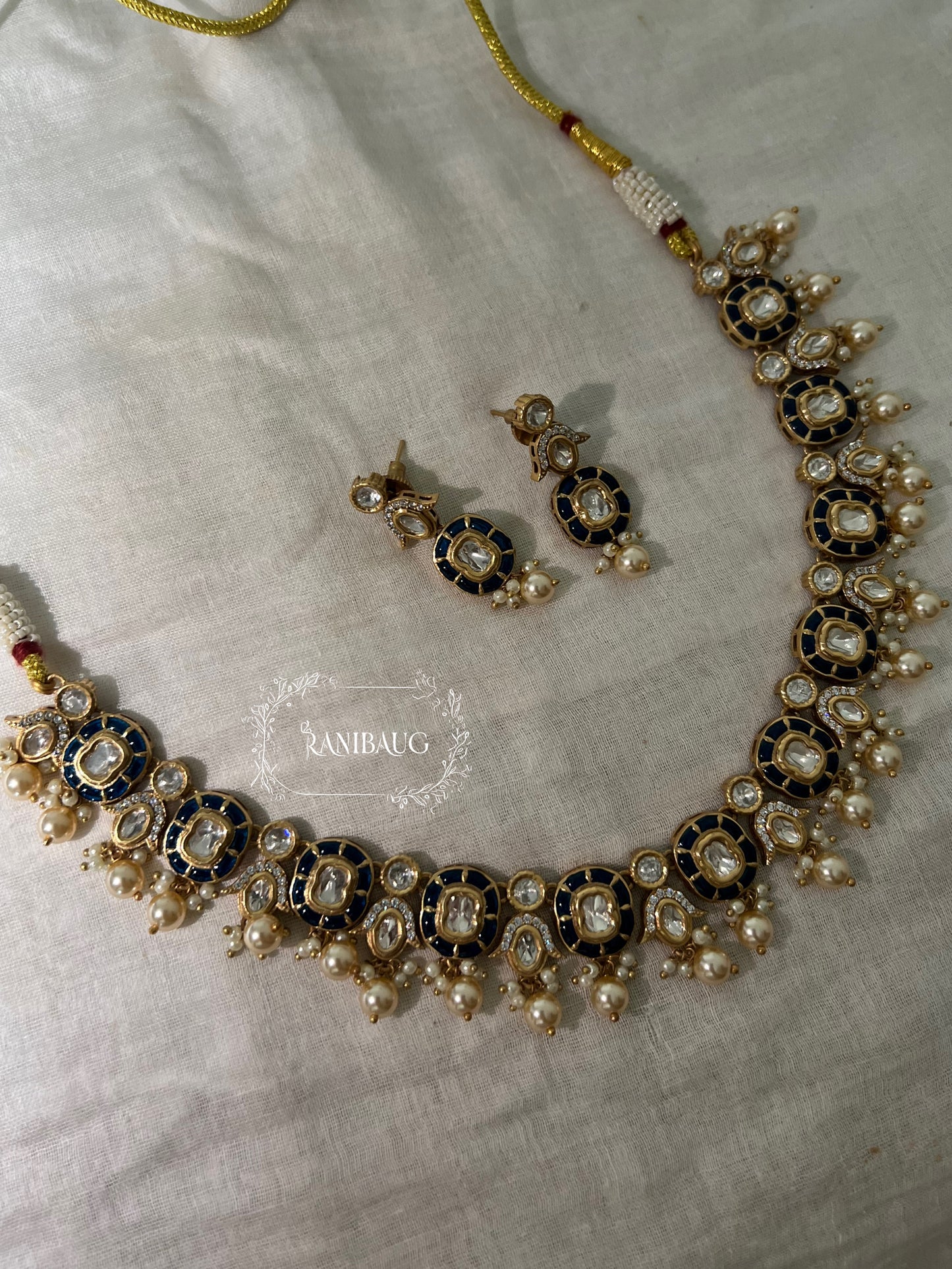 Aarika Polki Studded Rich Gold Finish Pearl Adorned Royal Necklace Jewellery Set By Ranibaug