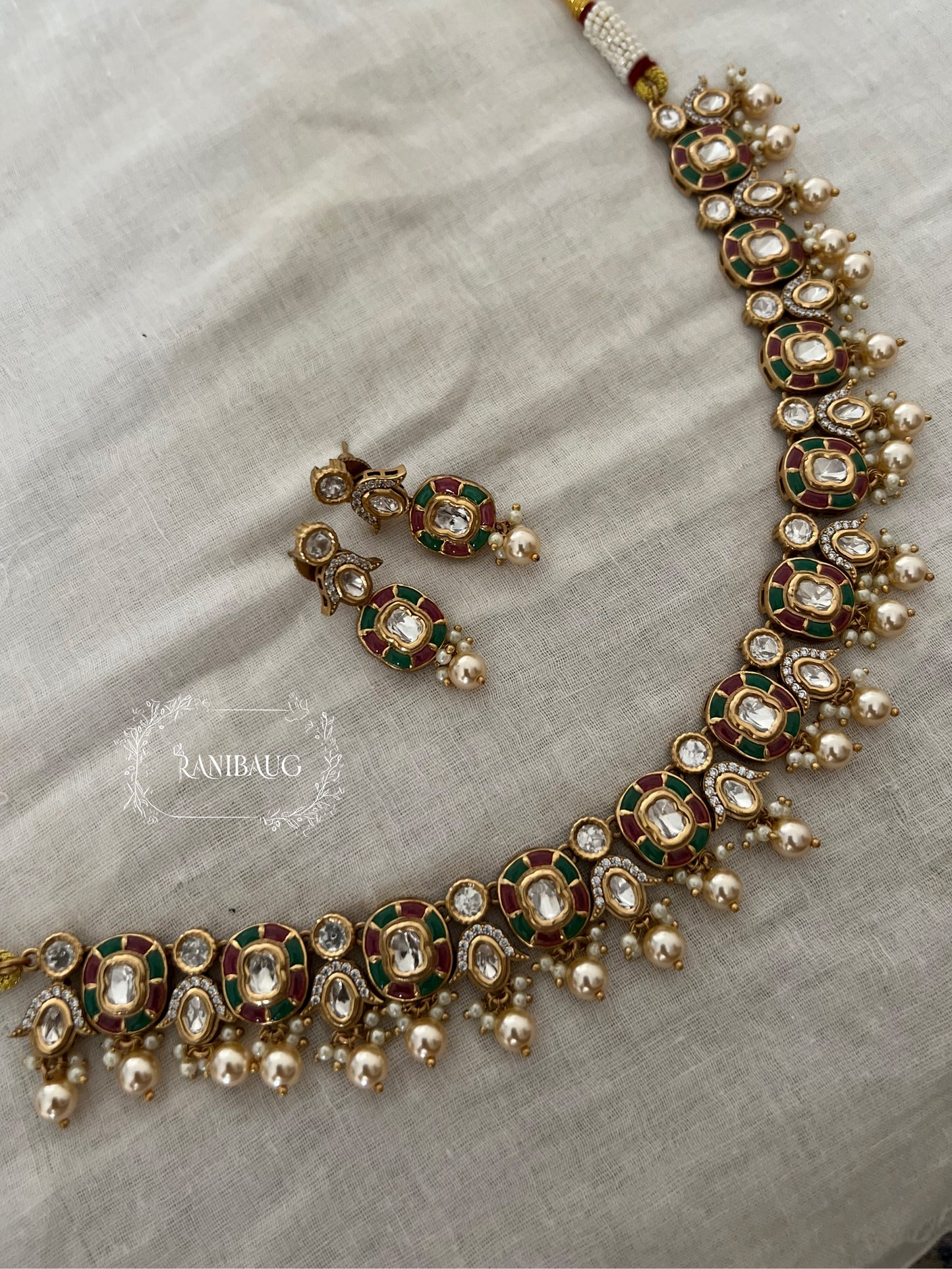 Aarika Polki Studded Rich Gold Finish Pearl Adorned Royal Necklace Jewellery Set By Ranibaug