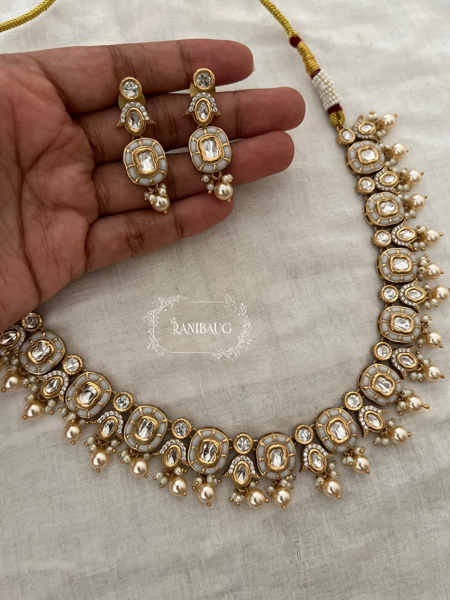 Aarika Polki Studded Rich Gold Finish Pearl Adorned Royal Necklace Jewellery Set By Ranibaug