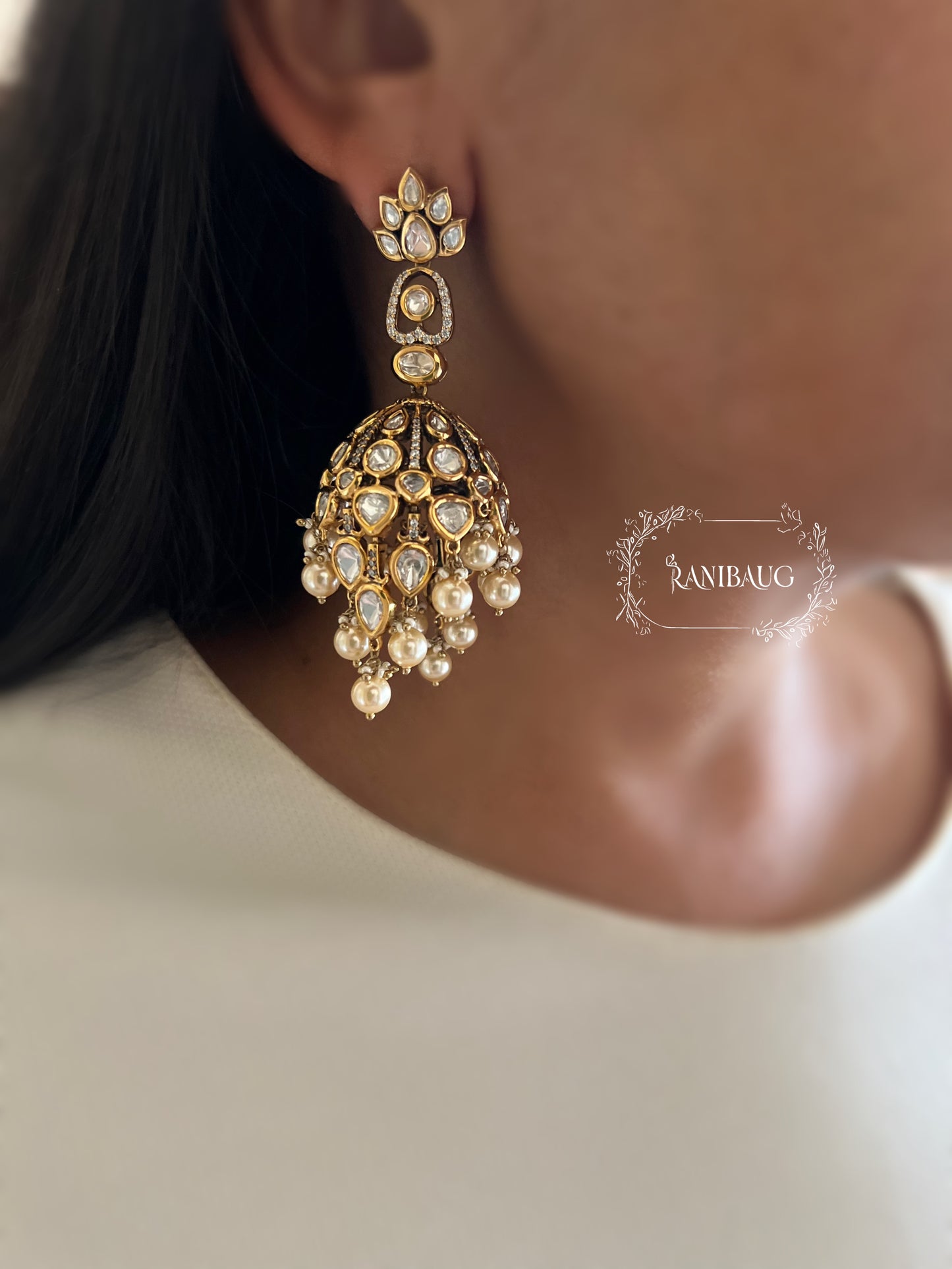 Alaana Regal Kundan-Polki Jhumka Earrings with Pearl Clusters in Antique Gold Finish by Ranibaug | Trendiest Wedding Earring Collection in India 2026