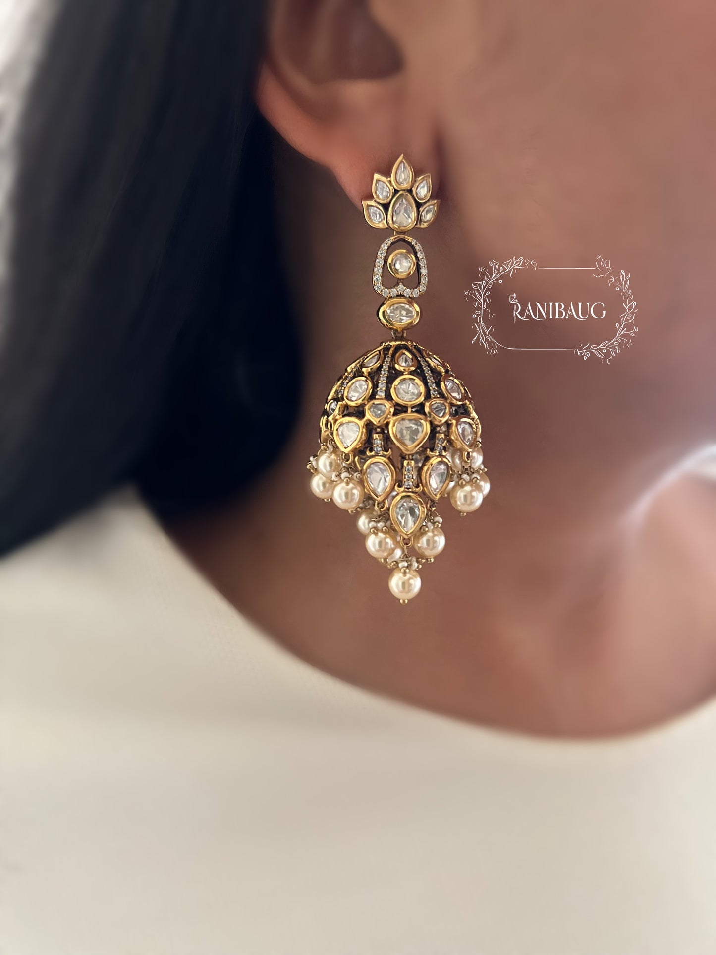 Alaana Regal Kundan-Polki Jhumka Earrings with Pearl Clusters in Antique Gold Finish by Ranibaug | Trendiest Wedding Earring Collection in India 2026