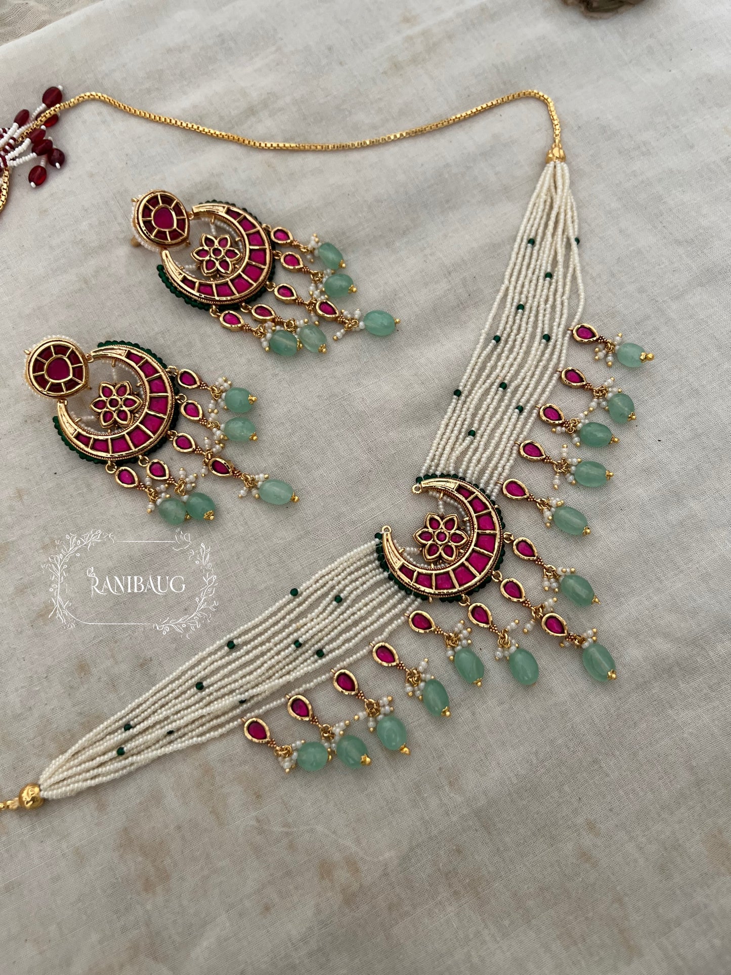 Amayra Moon Crescent Chand Motif Inspired Pastel Mint Stone Drops Gold Finish Choker Set By Ranibaug