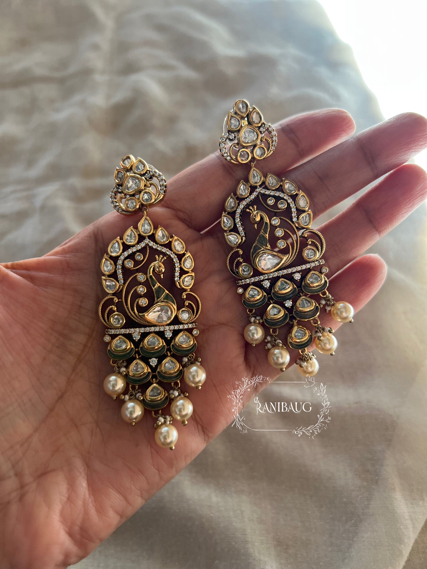 Amisha Antique Gold Victorian Finish Statement Peacock Polki Dangler Earrings With Pearl Fringe By Ranibaug | 2026 Festive Earrings Collection