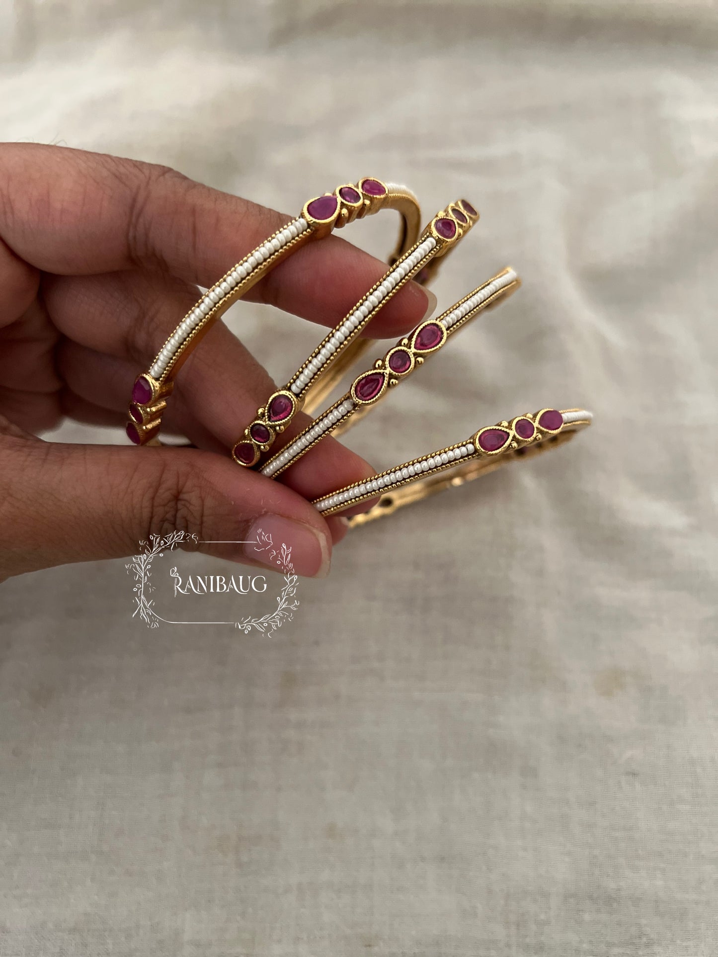 Anagha Ranibaug Heritage Ruby Pearl Thin Minimal Gold Bangles (Set Of 4)