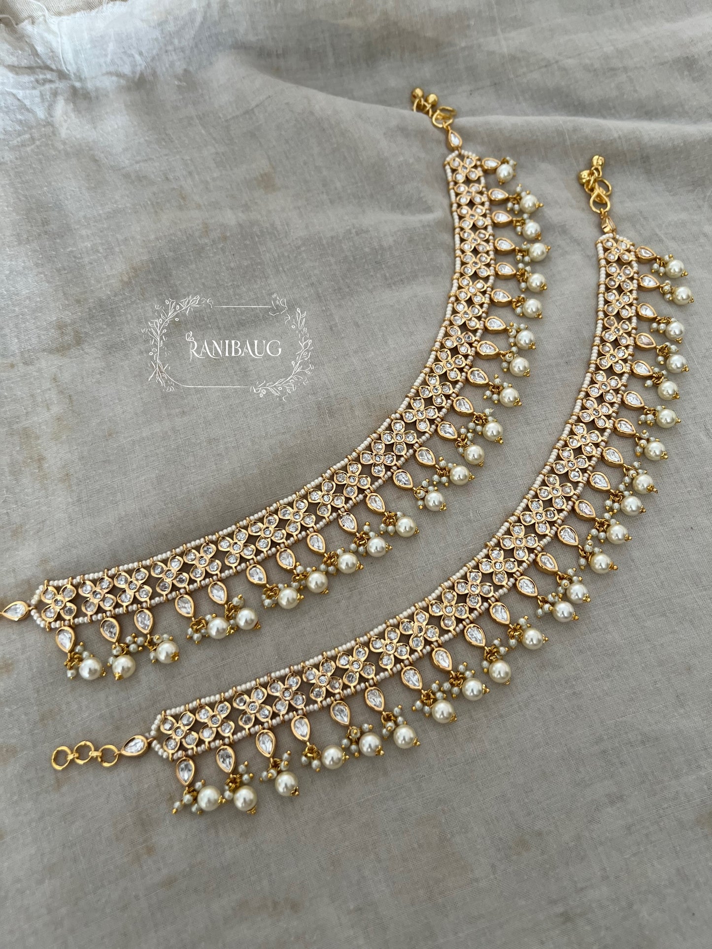 Anaya Designer Floral Kundan Teardrop Motif Jhanjhar Aklet Payal With Dangling Pearls By Ranibaug | Anklets Wedding Collection 2026