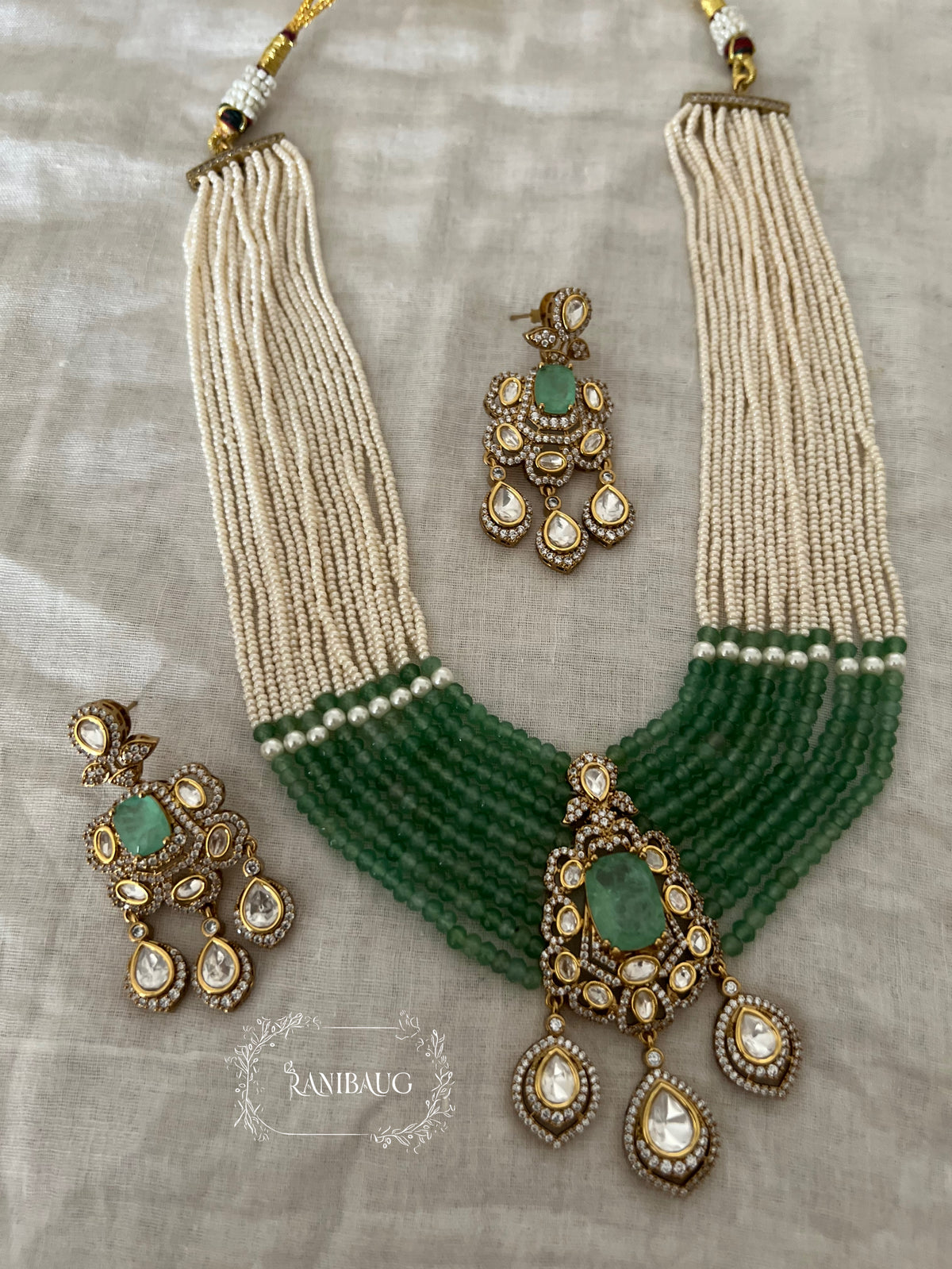 Aneri Pollki Kundan Emerald Pearl Strands Royal Layered Necklace Set By Ranibaug