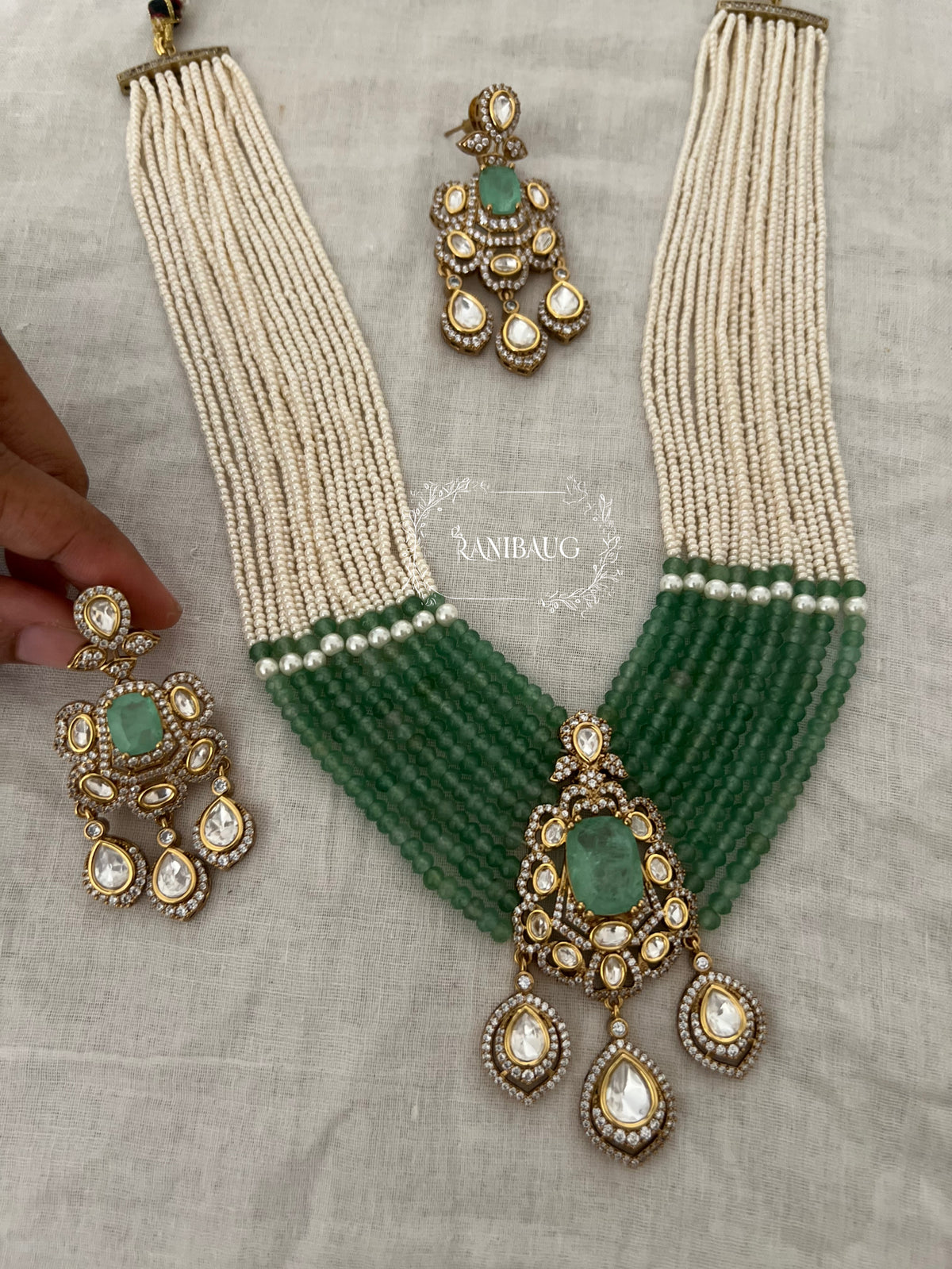 Aneri Pollki Kundan Emerald Pearl Strands Royal Layered Necklace Set By Ranibaug