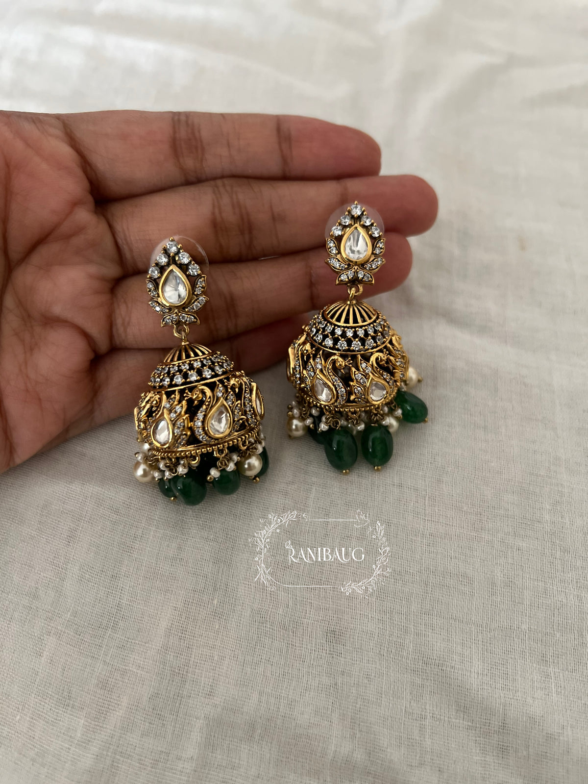 Anisha Polki Gold Finish Peacock Motif Festive Jhumka By Ranibaug