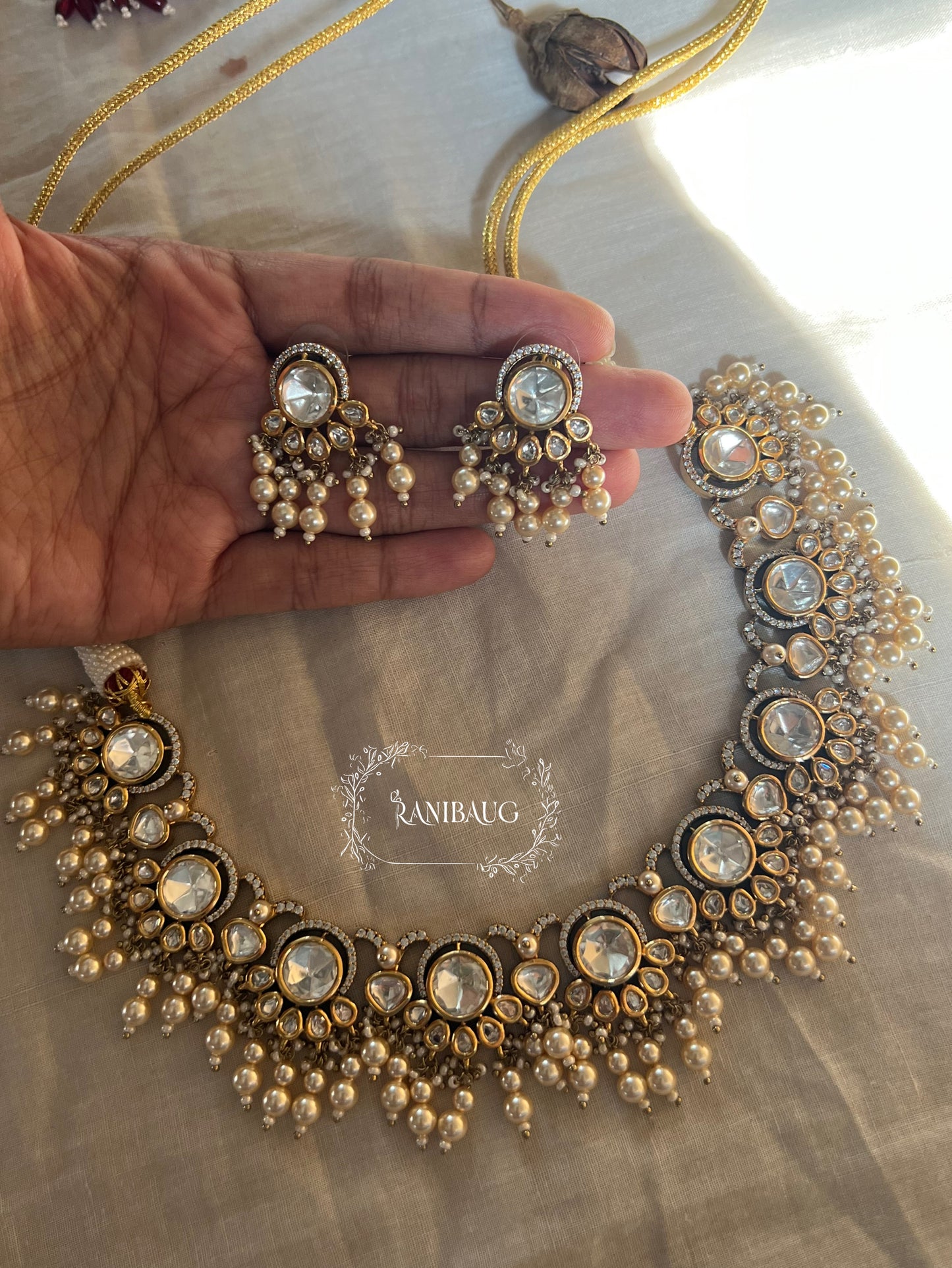 Aradhna Polki Necklace Jewelry Set In Premium Gold Finish With Dangling Pearls By Ranibaug