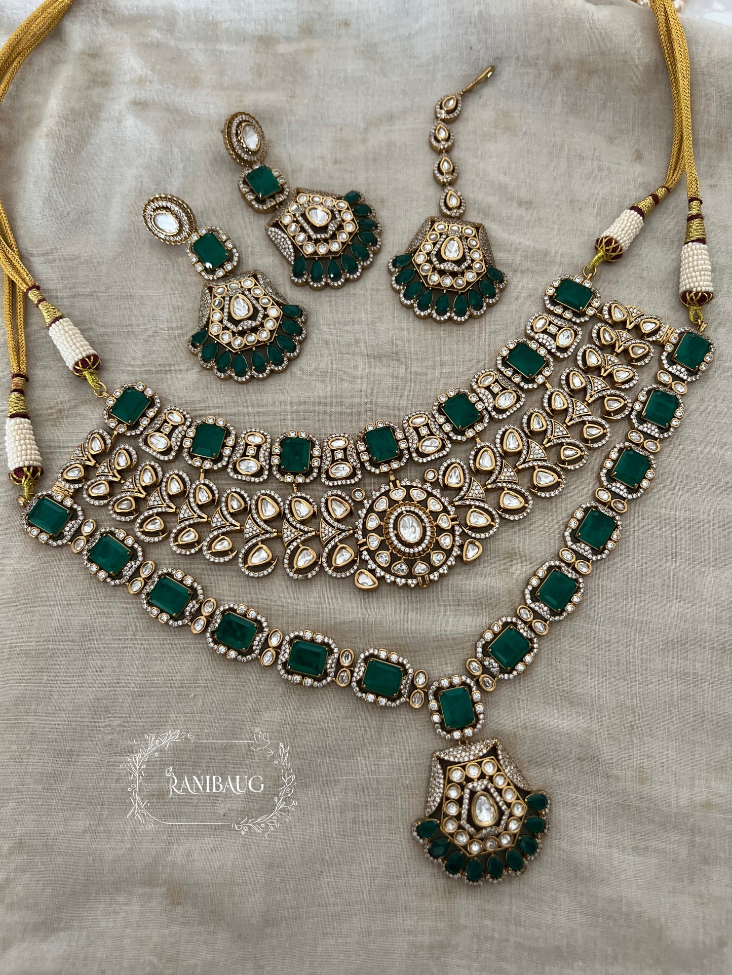 Ashi Royal Layered Emerald Green Gold Finish Polki Studded Necklace Set With Maang Tikka By Ranibaug