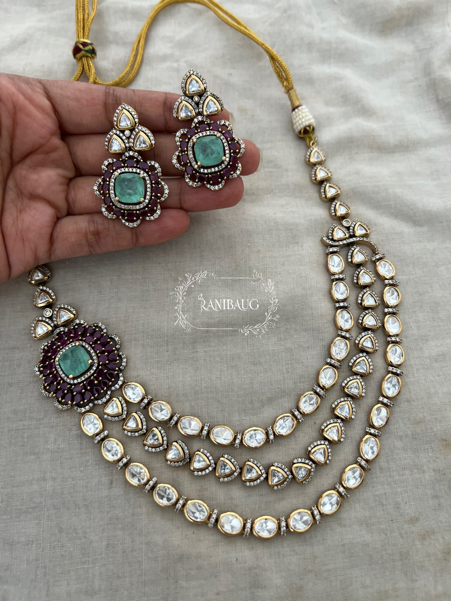 Ashvika Rich Polki Adorned In 3 Layers Attached To A Floral Stud Masterpiece Jewellery Set By Ranibaug