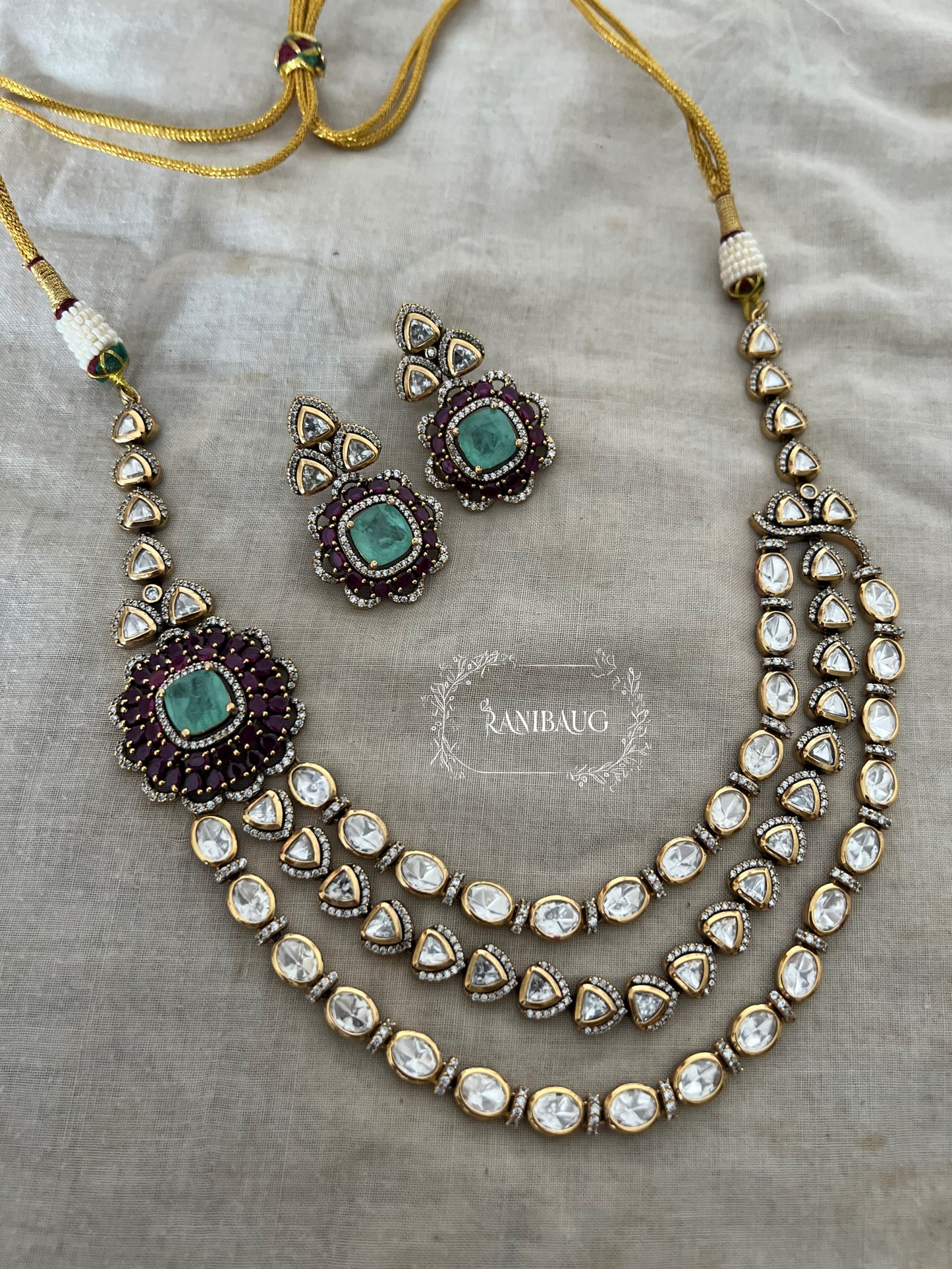 Ashvika Rich Polki Adorned In 3 Layers Attached To A Floral Stud Masterpiece Jewellery Set By Ranibaug