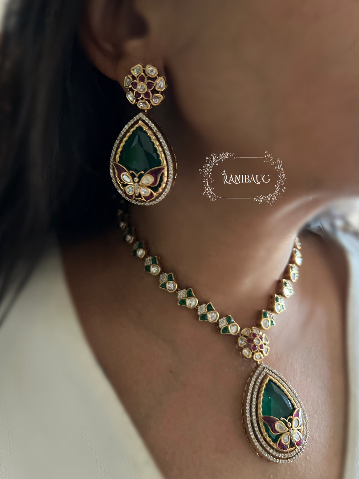 Avira Emerald Teardrop Butterfly Motif Gold Finish Designer Necklace Jewellery Set By Ranibaug