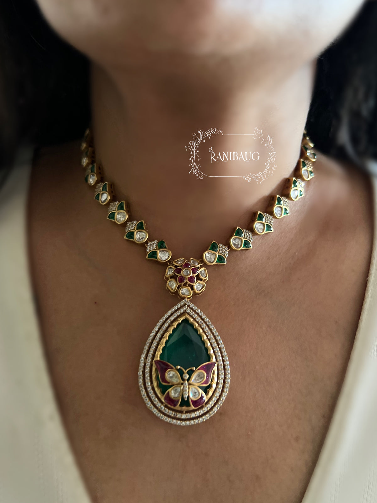 Avira Emerald Teardrop Butterfly Motif Gold Finish Designer Necklace Jewellery Set By Ranibaug