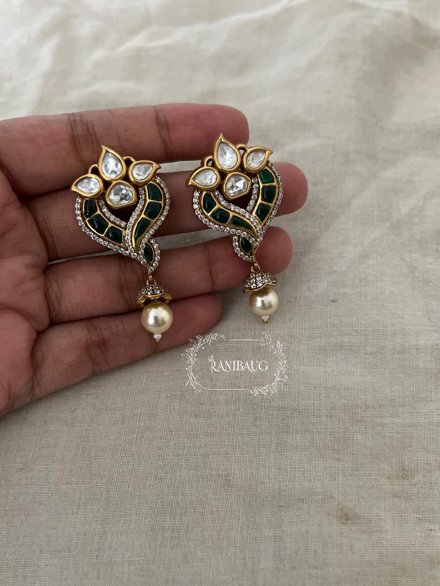 Avira Polki Kundan Enamel Gold Finish Designer Festive Ear Studs With Pearl Dangle By Ranibaug