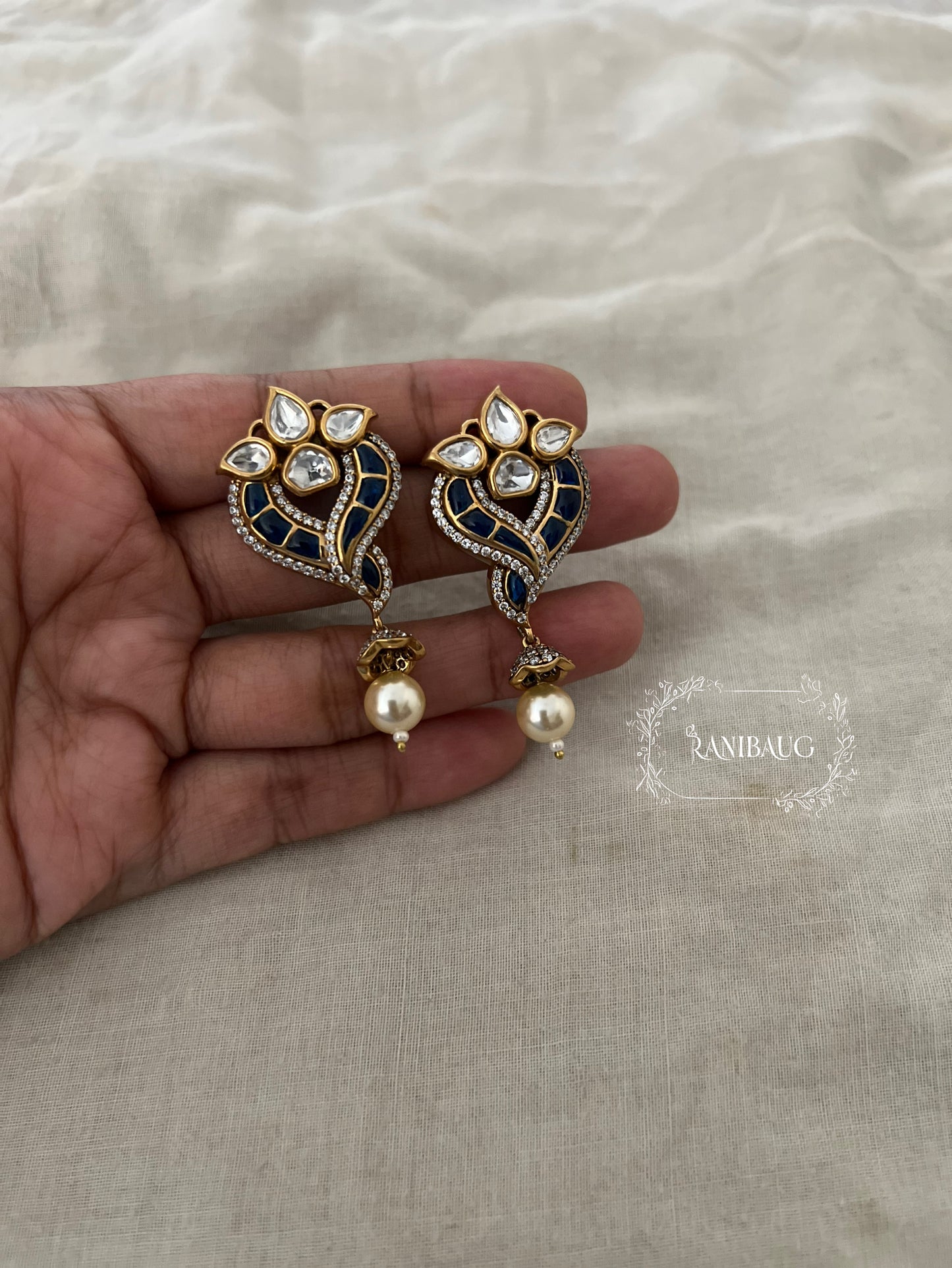 Avira Polki Kundan Enamel Gold Finish Designer Festive Ear Studs With Pearl Dangle By Ranibaug
