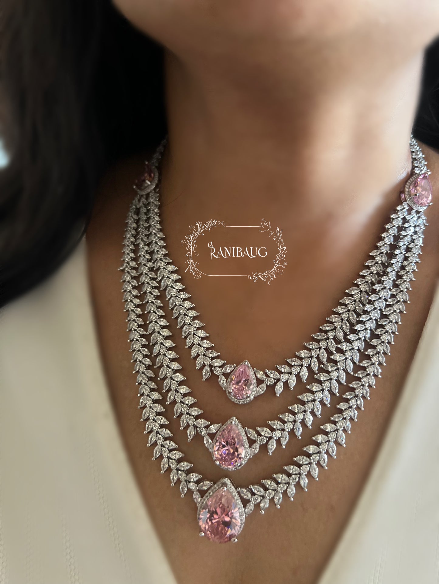 Bansi Layered Designer Diamond Necklace Jewelry Set By Ranibaug Adorned With Emerald And Pink Teardrop Stones