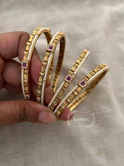 Bhagyashree Heritage Pearl Linked Gold Bangles With Ruby Accents (Set Of 4)