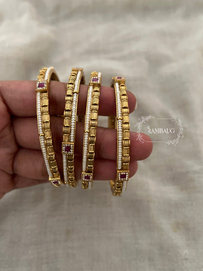 Bhagyashree Heritage Pearl Linked Gold Bangles With Ruby Accents (Set Of 4)