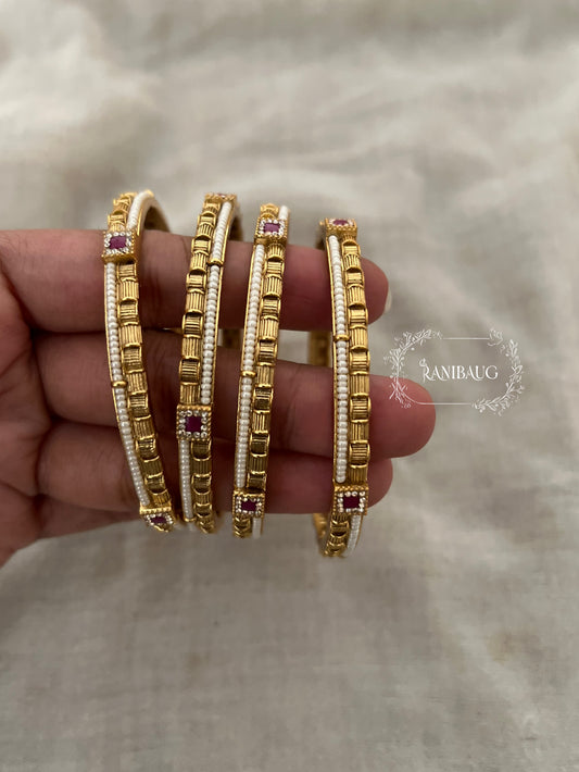 Bhagyashree Heritage Pearl Linked Gold Bangles With Ruby Accents (Set Of 4)