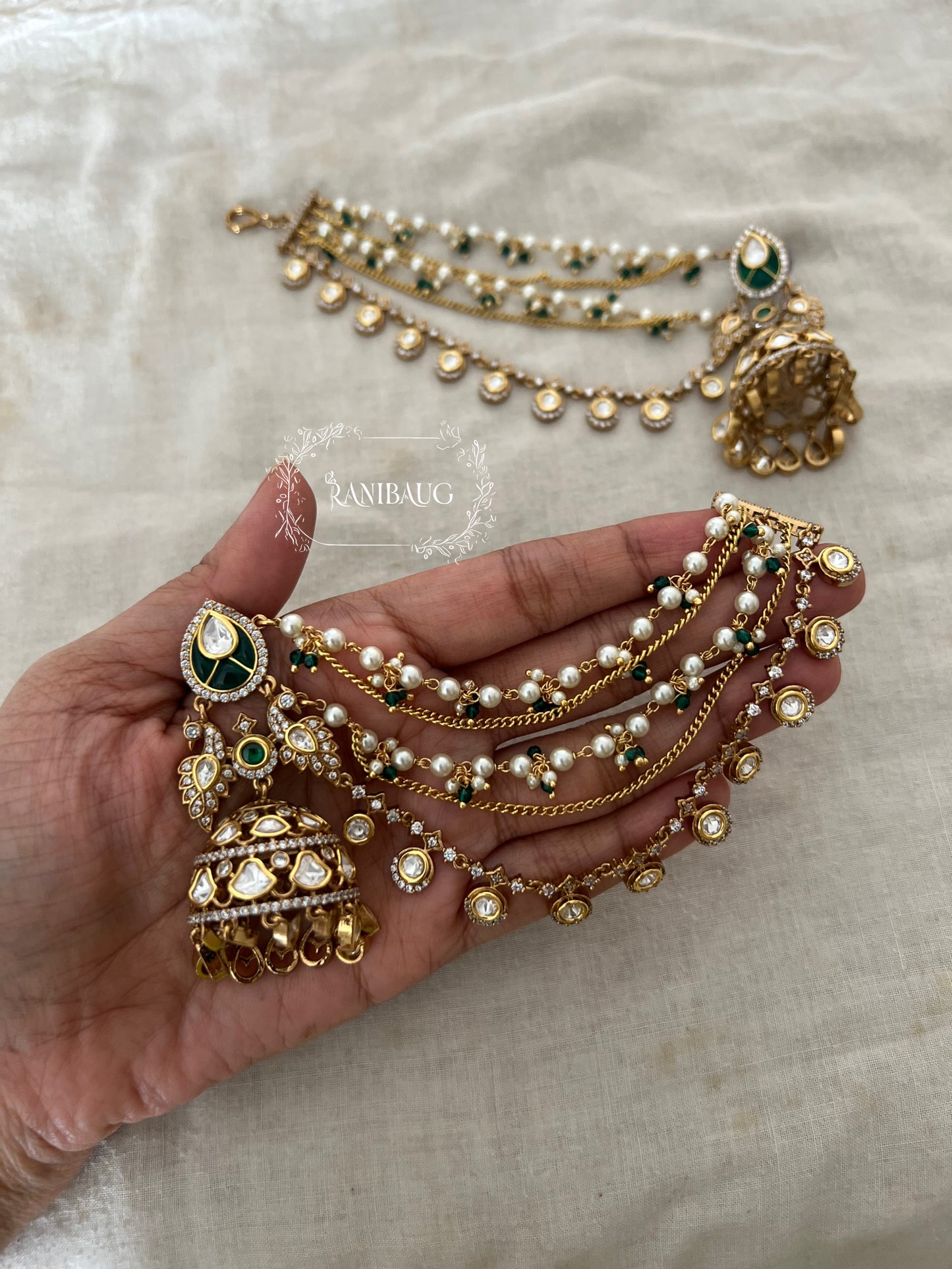 Bharti Peacock Motif Bahubali Jhumka With Hair Chain | Gold Plated Polki Kundan Hair And Ear Jewelry By Ranibaug | 2026 Jewelry Trends