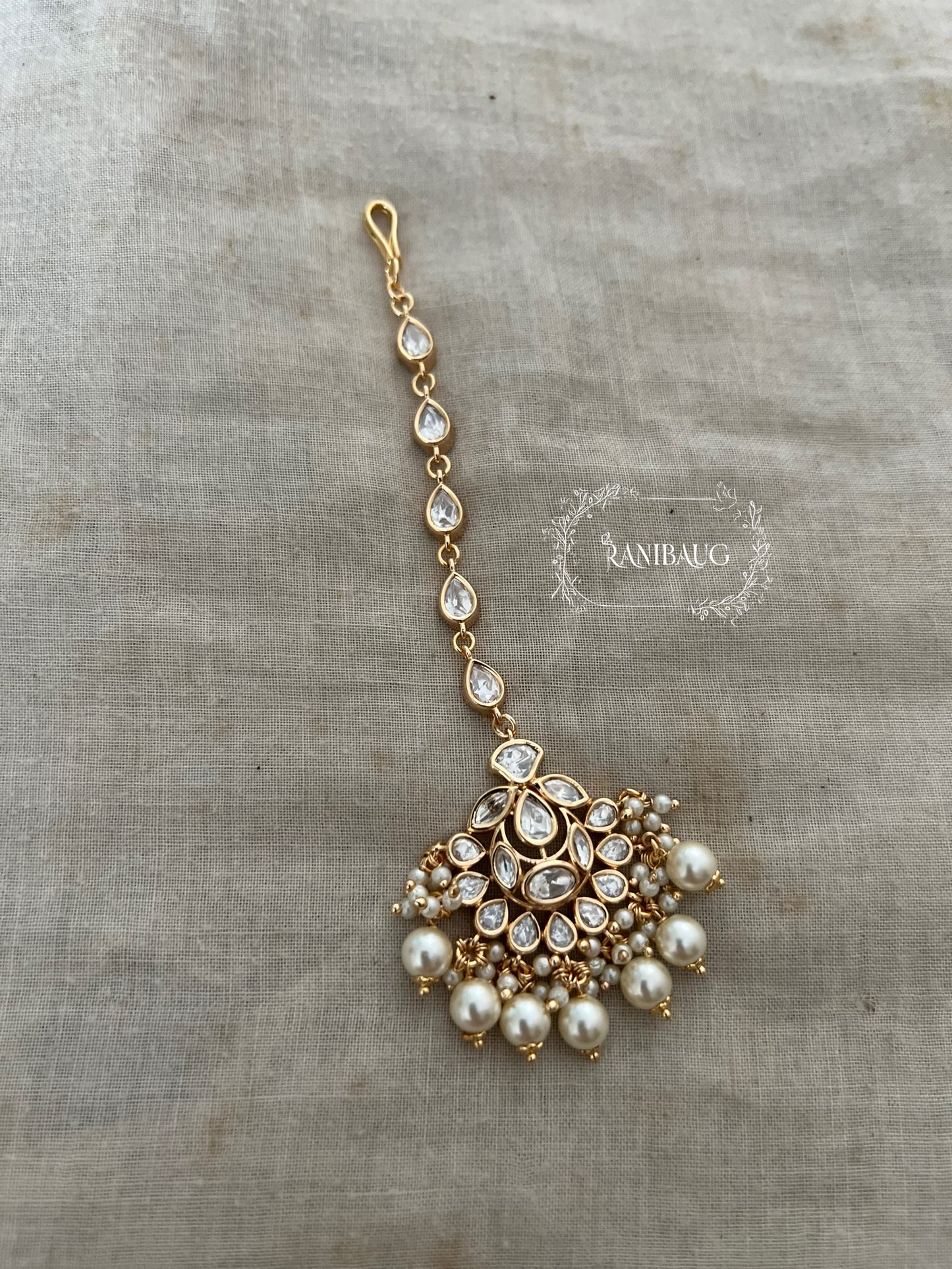 Midha Moon Motif Mossainite Kundan Maang Tikka In Gold Finish And Pearl Dangler By Ranibaug | Most Loved Maang Tikka Jewelry
