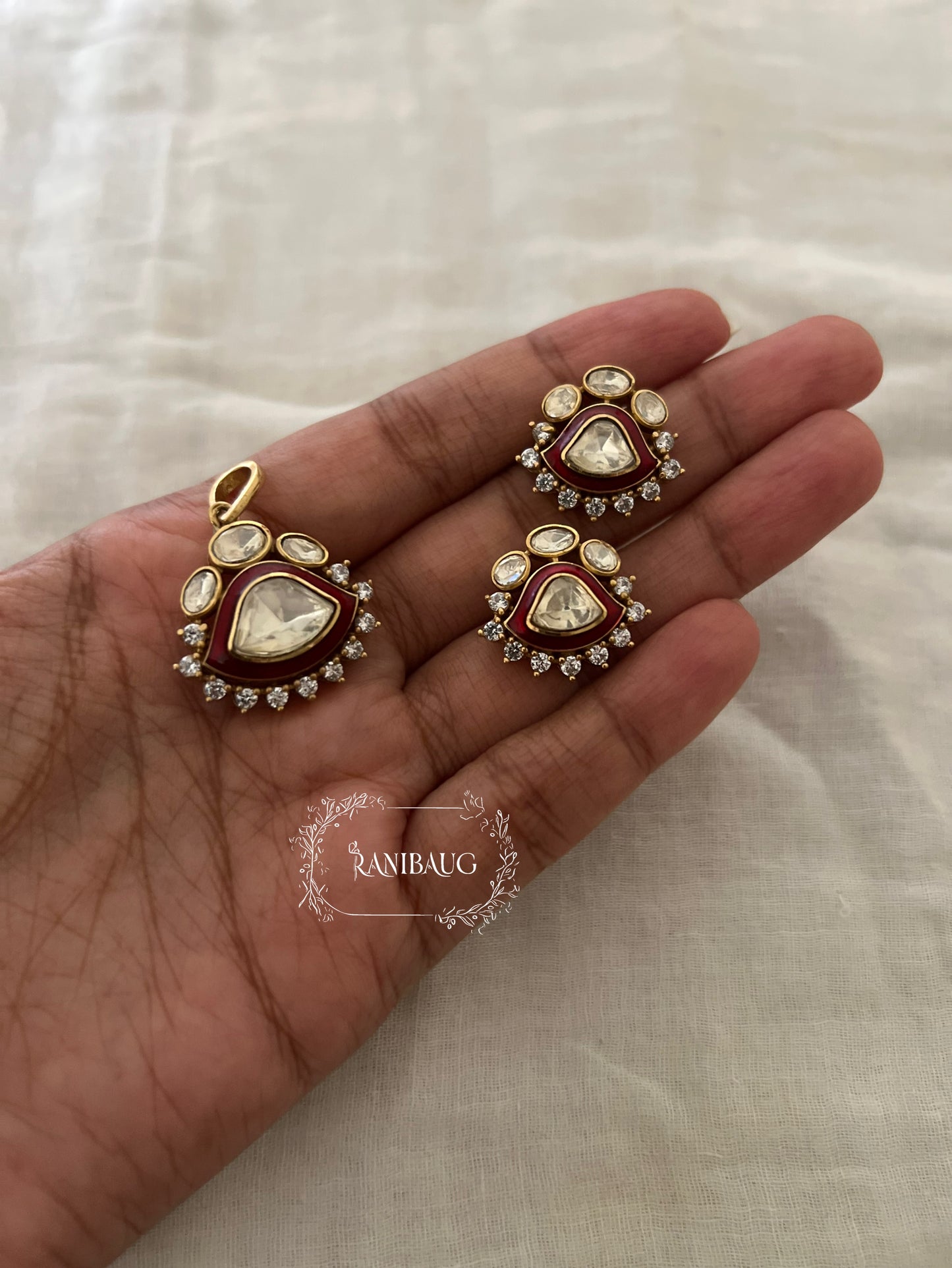 Indraja Red And Green Gold Plated Polki Kundan Pendant Set By Ranibaug | A Designer Jewelry Piece
