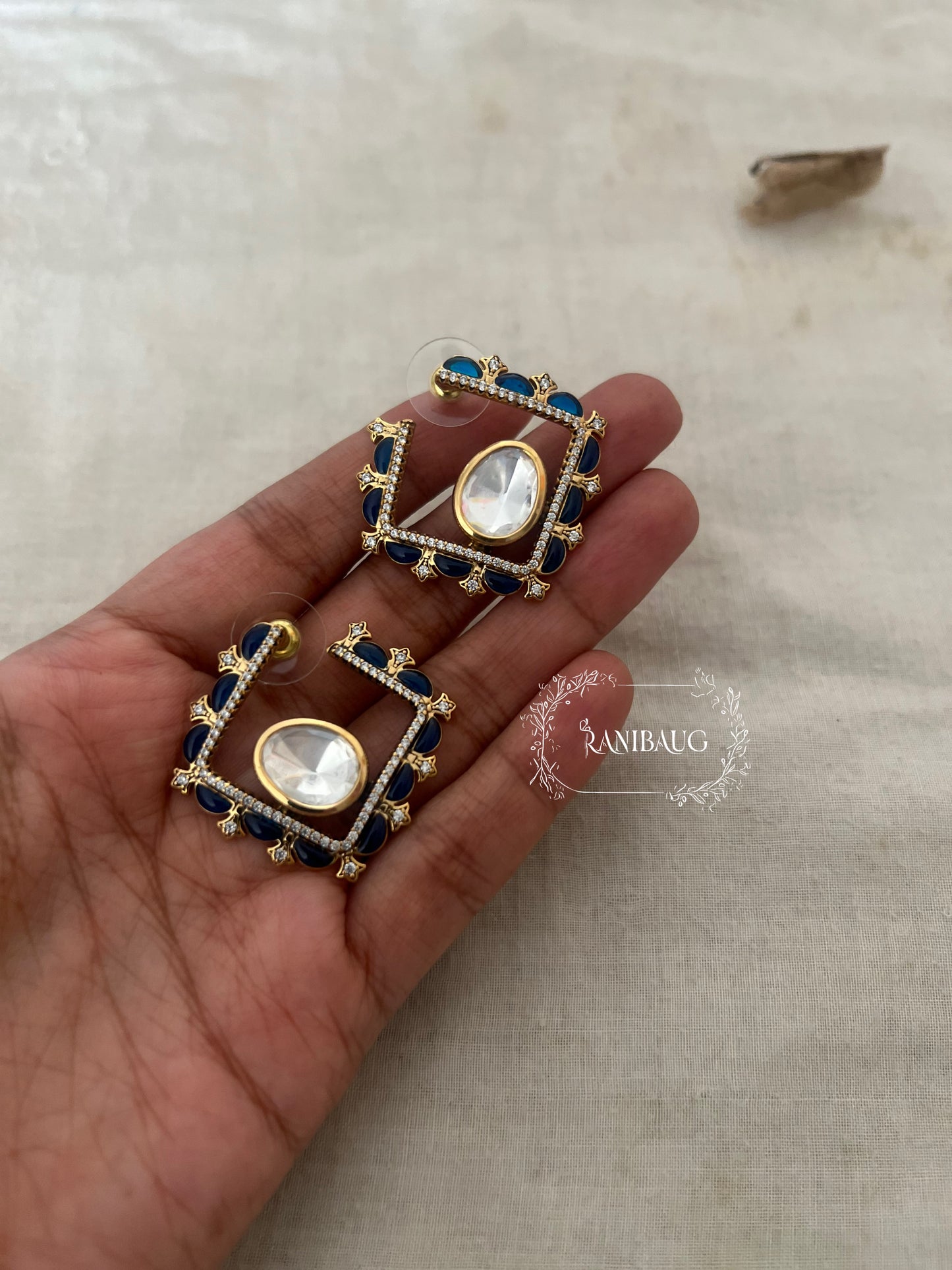 Chaarvi Square Stud Earrings Featuring Polki Center Stone In Premium Gold Plating By Ranibaug | Trendy Ear Stud Earrings