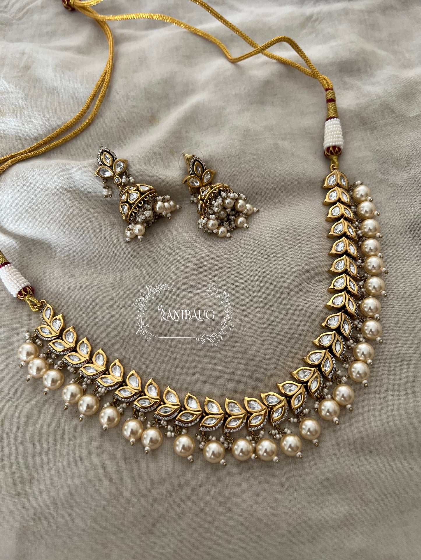 Chaya Leaf Kundan And Pearl Necklace Set In Rich Gold Finish By Ranibaug | Wedding Necklace Jewelry