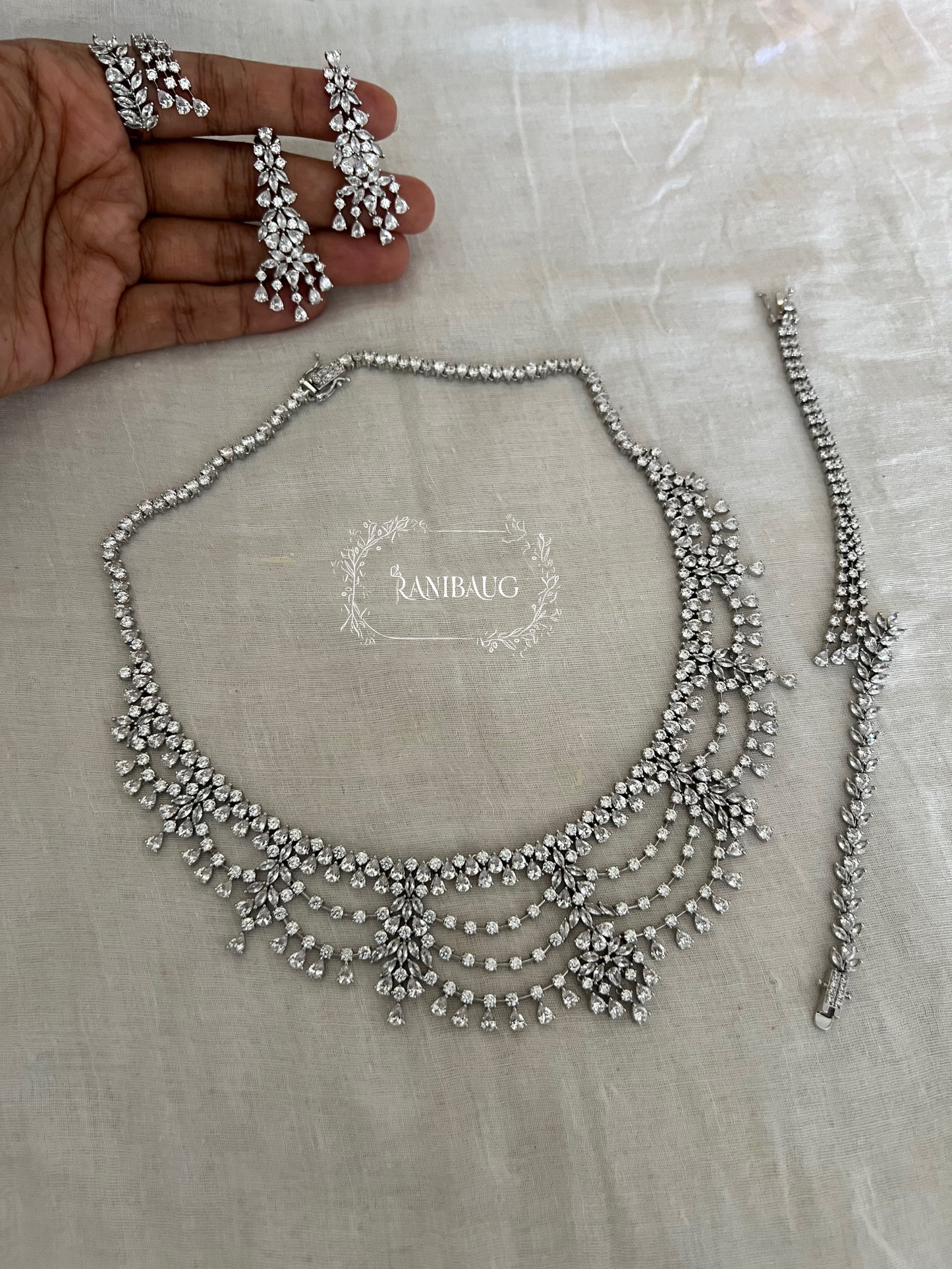 Cynthia Silver Tone Finsih Layered Rich Diamond Stones Studded Royal Statement Set By Ranibaug
