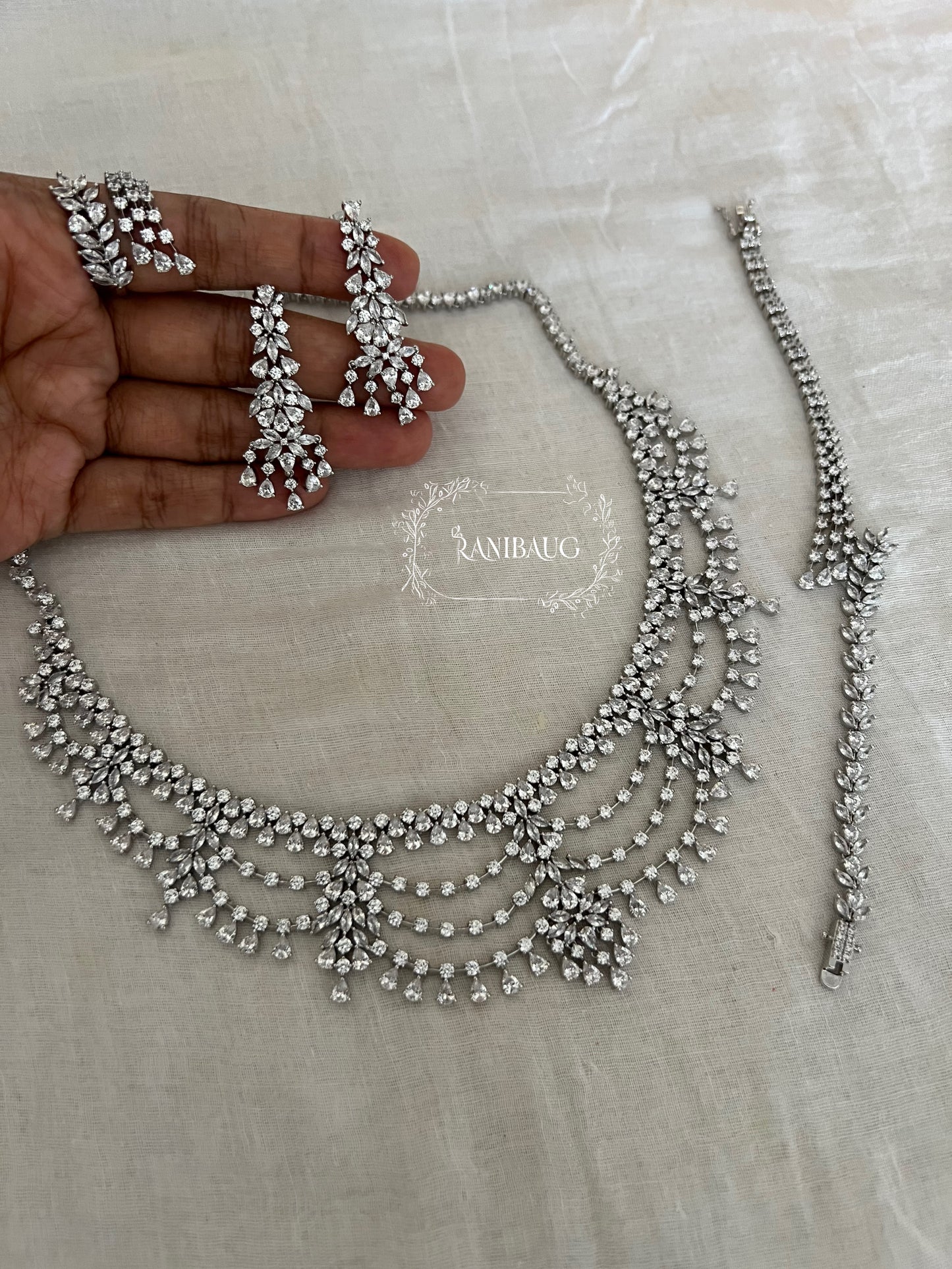 Cynthia Silver Tone Finsih Layered Rich Diamond Stones Studded Royal Statement Set By Ranibaug