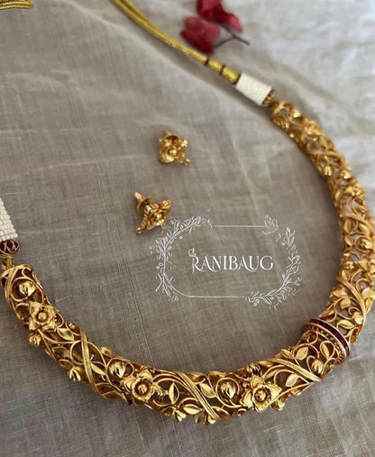 Deepti Hasli Antique Gold Finish Unique Neck Piece Jewelry Set With Intricate Floral Work By Ranibaug
