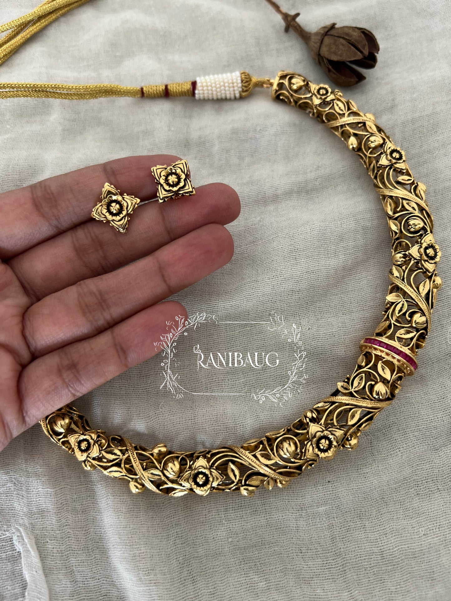 Deepti Hasli Antique Gold Finish Unique Neck Piece Jewelry Set With Intricate Floral Work By Ranibaug
