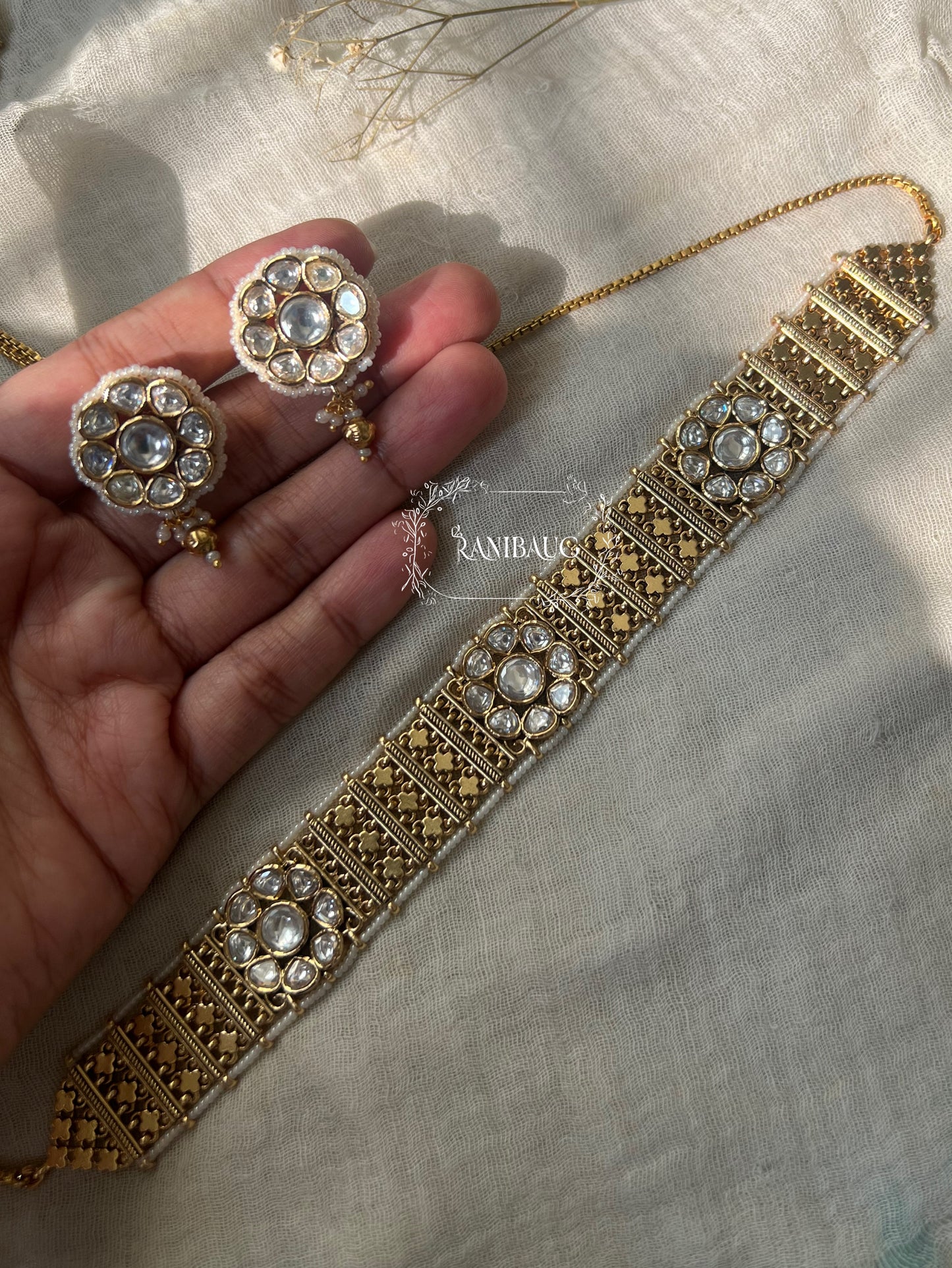 Devika Floral Motif Kundan Detailed Intricate Choker Set In Rich Gold Tone By Ranibaug | Heritage Temple Jewellery Set 2026