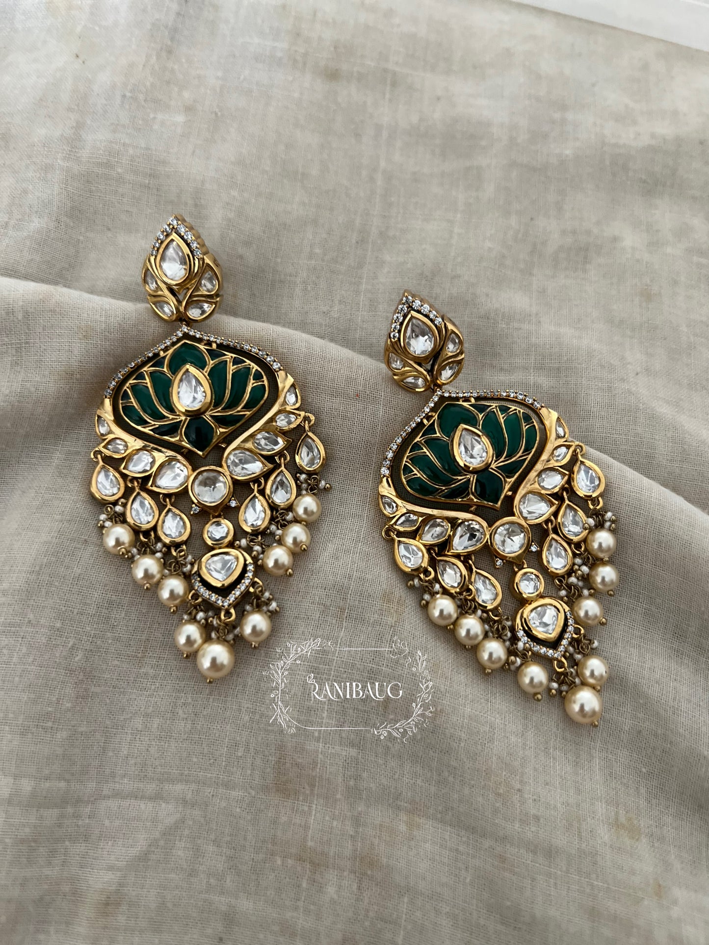 Devika Lotus Motif Emerald Green Color Polki Studded Rich Gold Finish Pearl Dangler Earrings By Ranibaug