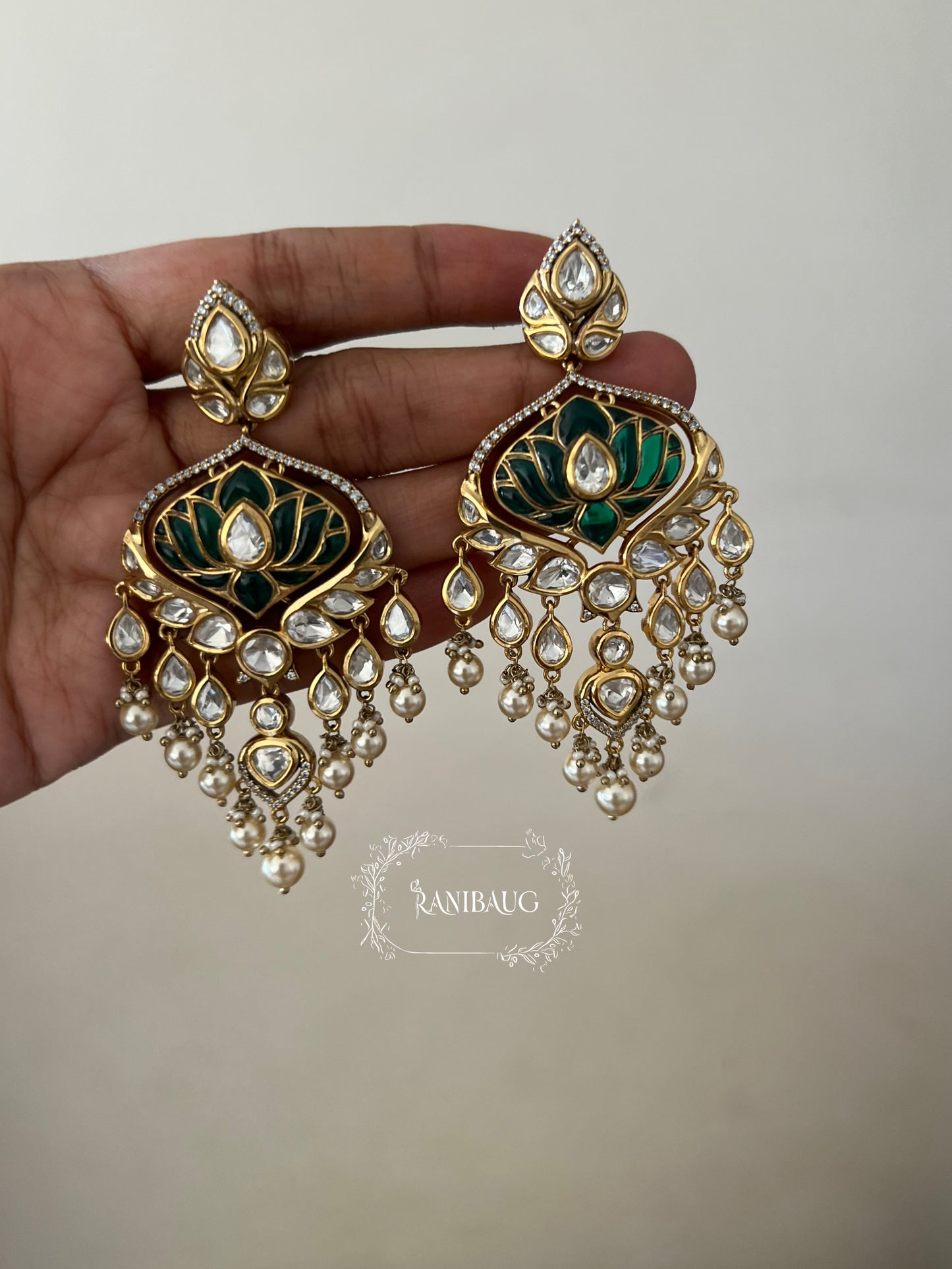 Devika Lotus Motif Emerald Green Color Polki Studded Rich Gold Finish Pearl Dangler Earrings By Ranibaug
