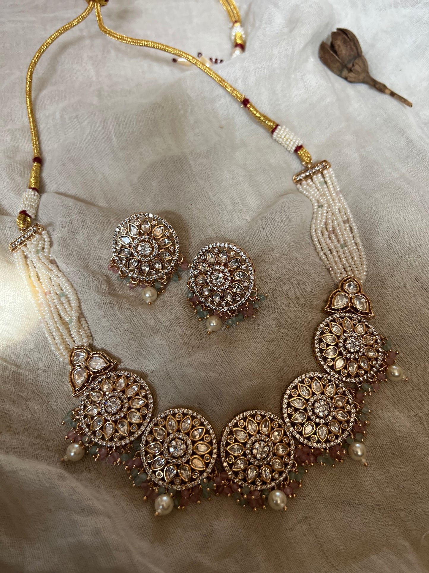 Ekta Gold Plated Mossainite Stones Set In Rich Pearl Bead Tassels Necklace Jewellery Set By Ranibaug